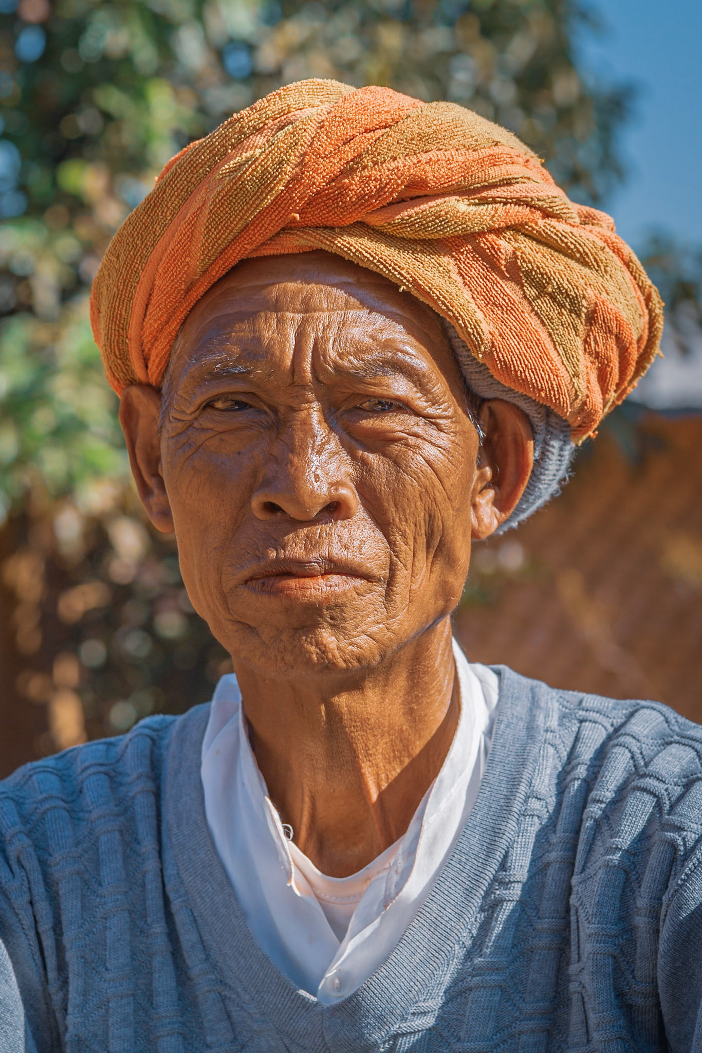This gentleman, from the Pa-O tribe, was making Betel Leaf by the side of the road. Betel is a leaf that is mixed with gum and/or tobacco to create a stimulant and medicine across Asia. It stains the teeth a blood coloured red so it is very noticable! Paul (our trek guide) stopped to buy some from this man, and while we were talking I asked if he would mind a portrait photo. He kindly obliged and was delighted with the shot!