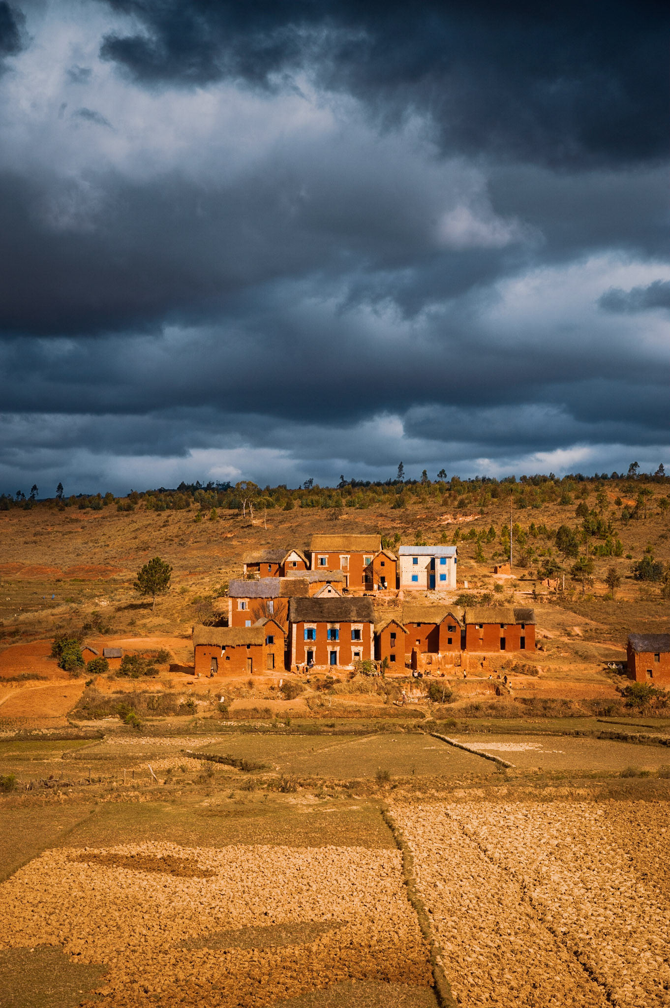 This was our last day on the RN7 through Madagascar. I was continually amazed at the unique beauty of these red mud-brick houses, with their catching blue windows. But I had still yet to get the shot that I wanted. Thankfully, while climbing this valley, we looked back to this scene. With the aid of a Lee Graduated ND filter I grabbed this dramatic landscape, and featuring the houses that I so wanted to capture.