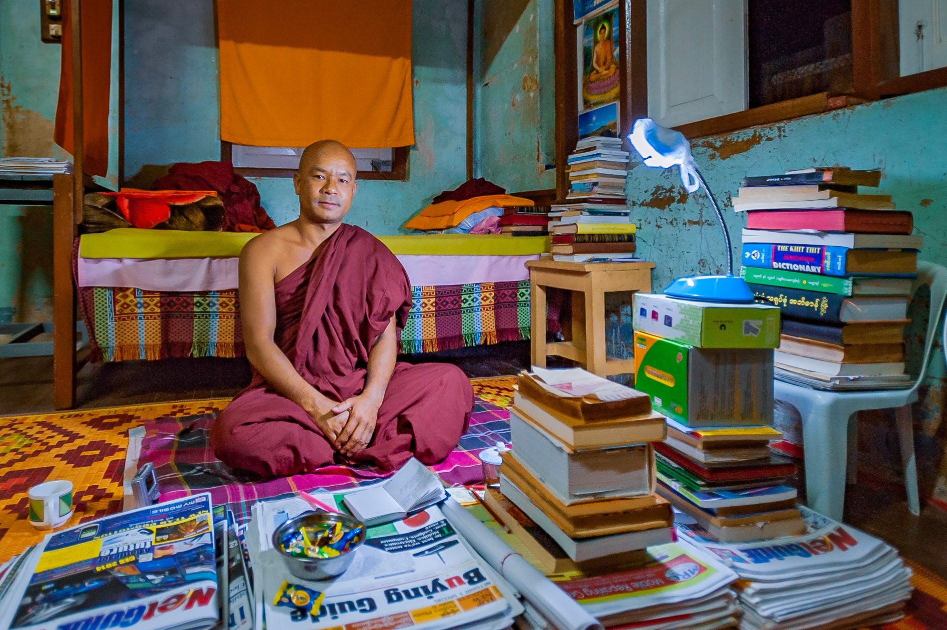 While in Nyaungshwe, I made friends with a monk! After meeting at the gates of the monastery we started talking about everything from the latest Nikon SLRs to the political situation in the Middle East. Simply fascinating. We were talking for so long that he invited me in for tea. His room was piled waist high in books and magazine - clearly absorbing everything he reads, he was a fountain of knowledge. Truely a precious experience I will forever treasure and I hope we keep in touch.