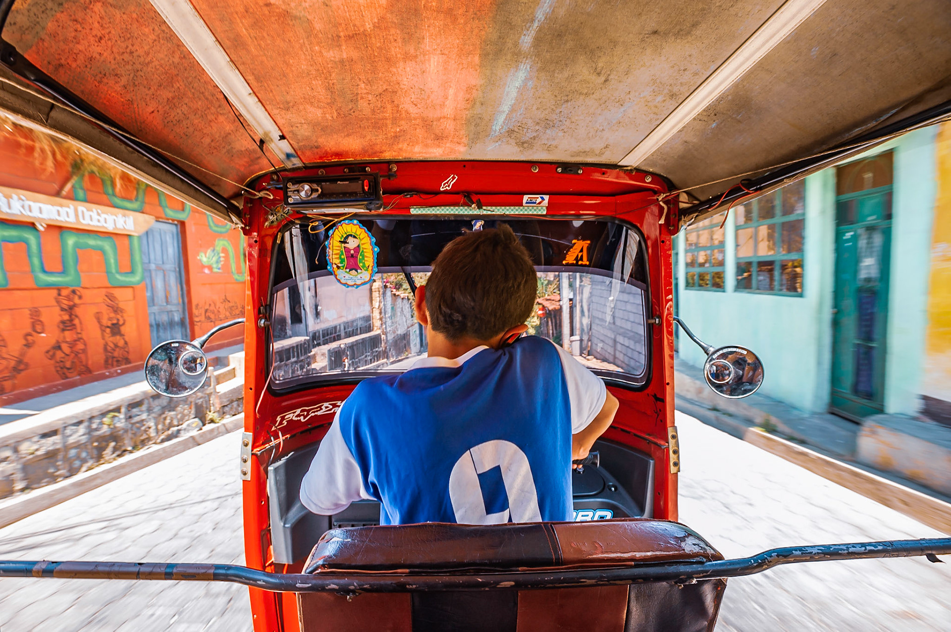 Hiking from San-Pedro village along the lake shore of Lake Atitlan, Guatemala, we stopped to grab a Tuk-Tuk… this lad was our driver, and when I asked him his ages he says "15"!!