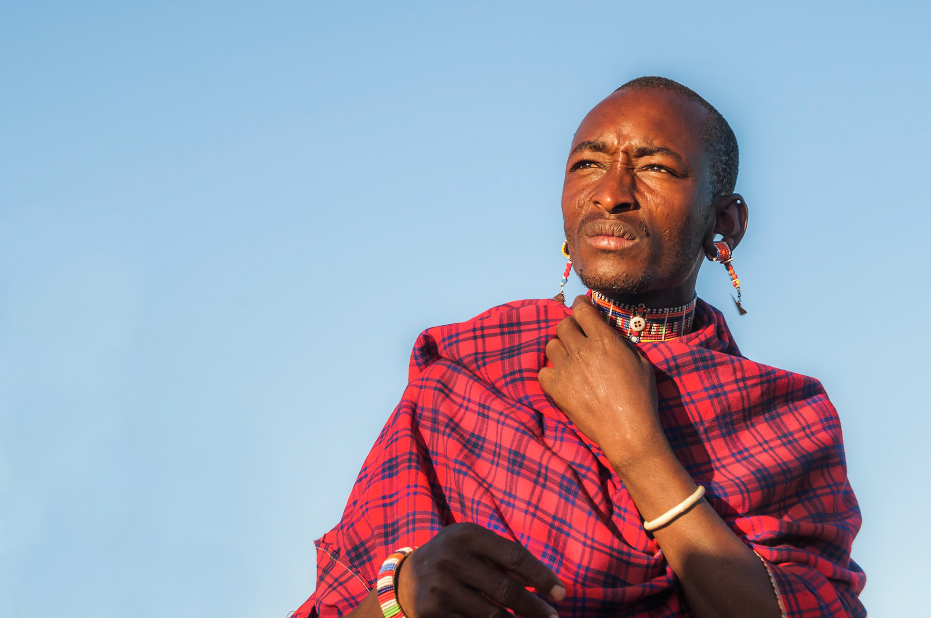 This really was one of those rare, exclusive and most magical of moments you are lucky enough to come across as a traveller and photographer. Kasaine Lepolosi (close to Zuwani estate, Taveta district, Kenya) was a Maasai community rarely  (if ever) visited by white people. Tourism was a complete new idea for them, and as a staff leader for GVI (Global Vision International) I was co-leading a group of western students to help educate and train these mighty warriors in alternative livelihoods and sustainable development. After 2 weeks of building respect, trust, rapport and relationships I was able to photograph these pure and genuine scenes of Maasai village life. Memories for life.