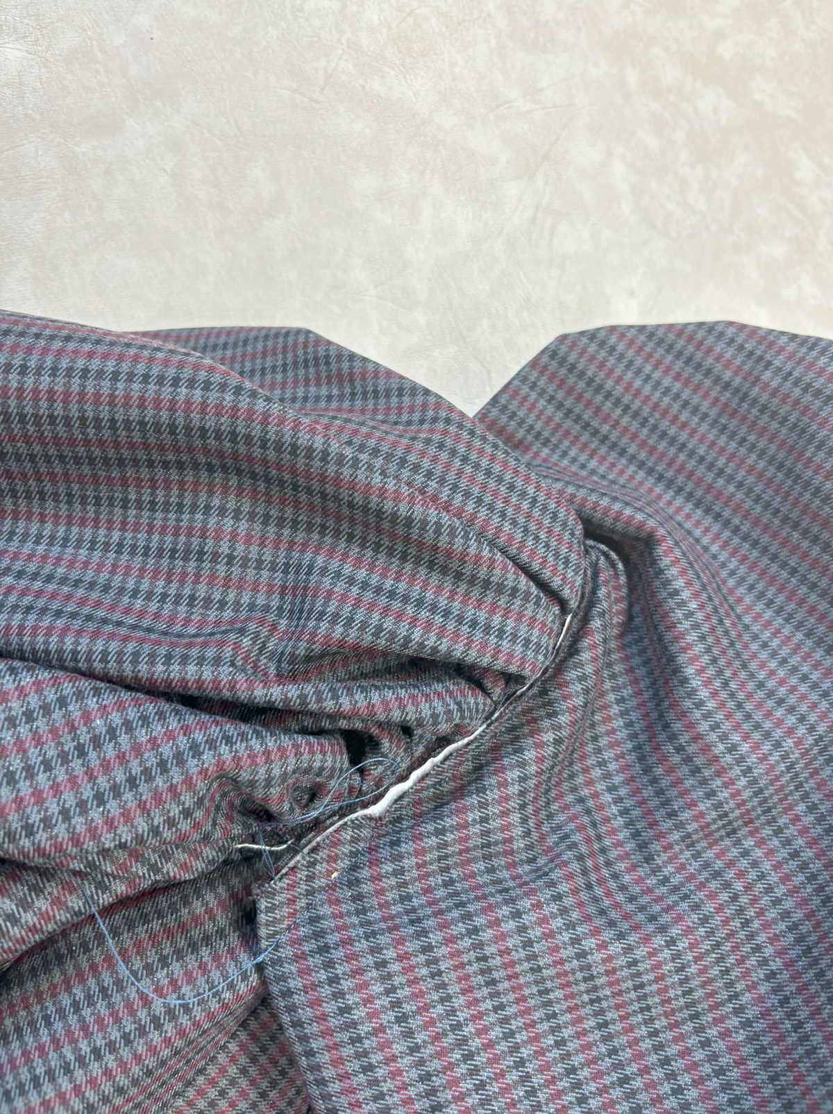 The petal on the sleeve was sewn separately from armscye and raw edge was exposed