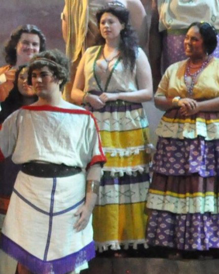 Cretan Citizen played by Aurora Sauer