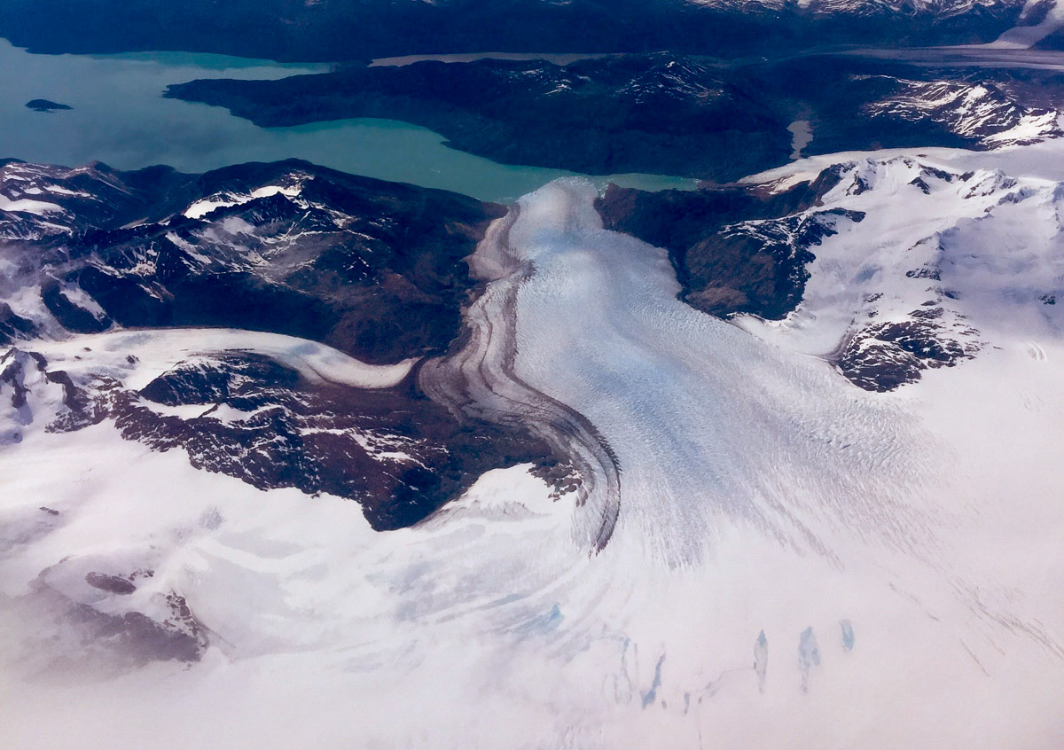 iPhone shot from the airplane, flying over a glacier