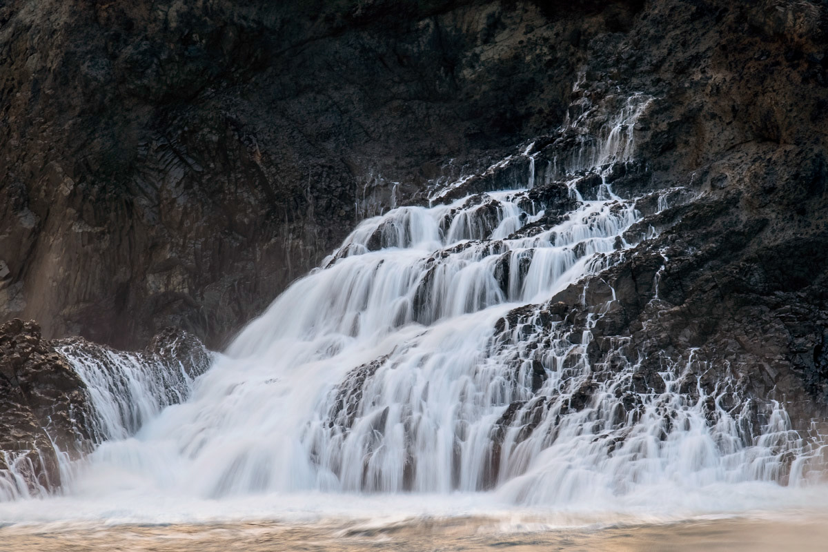 the sea hitting the rocks