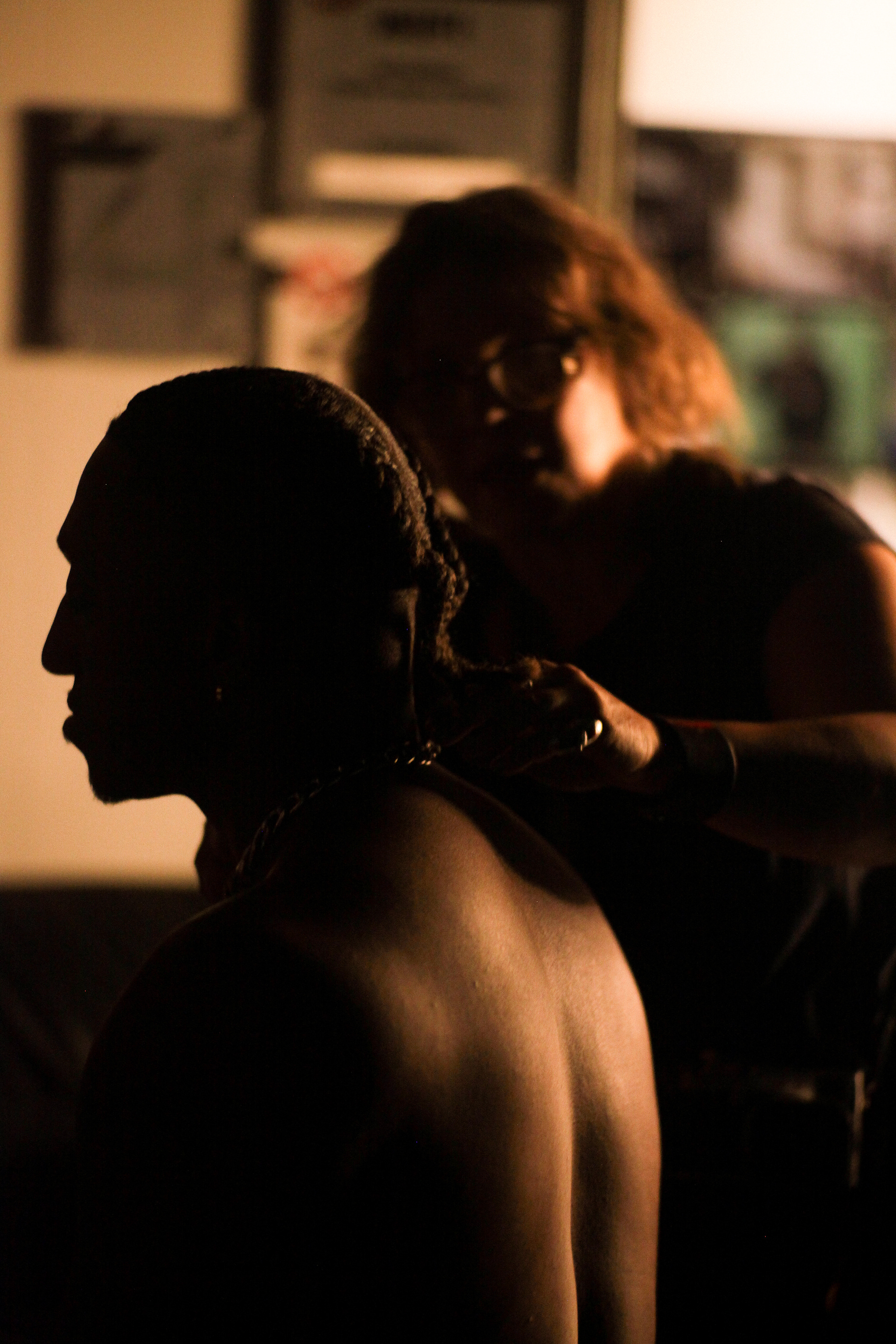 Stylist Andrea Jenkins helps rap artist Lecrae prepare to film the next shot of his music video in Atlanta, Ga on July 28, 2021. 