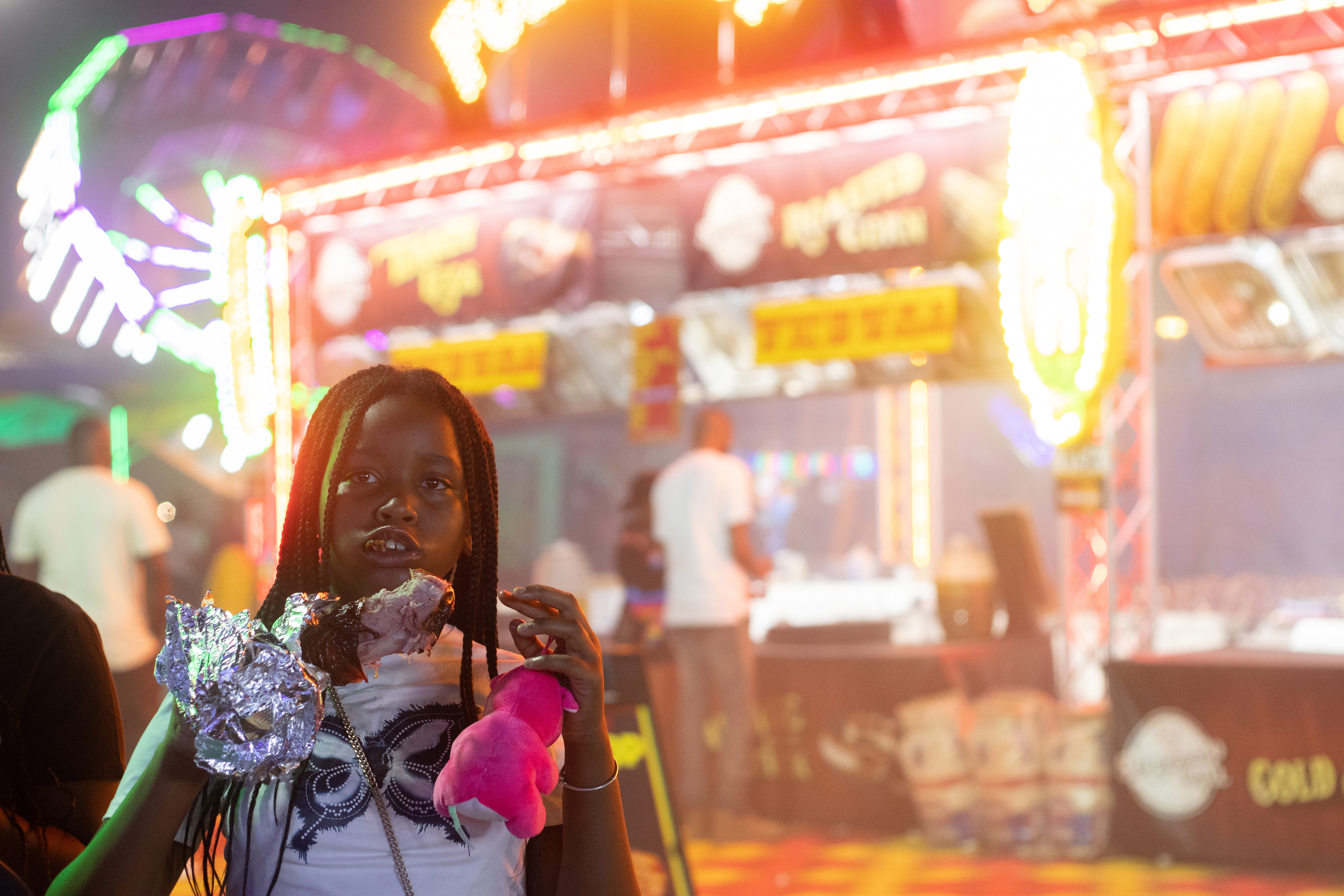 A fairgoer eats a turkey leg at the Georgia National Fairgrounds and Agriculture Center on Oct. 5, 2024.