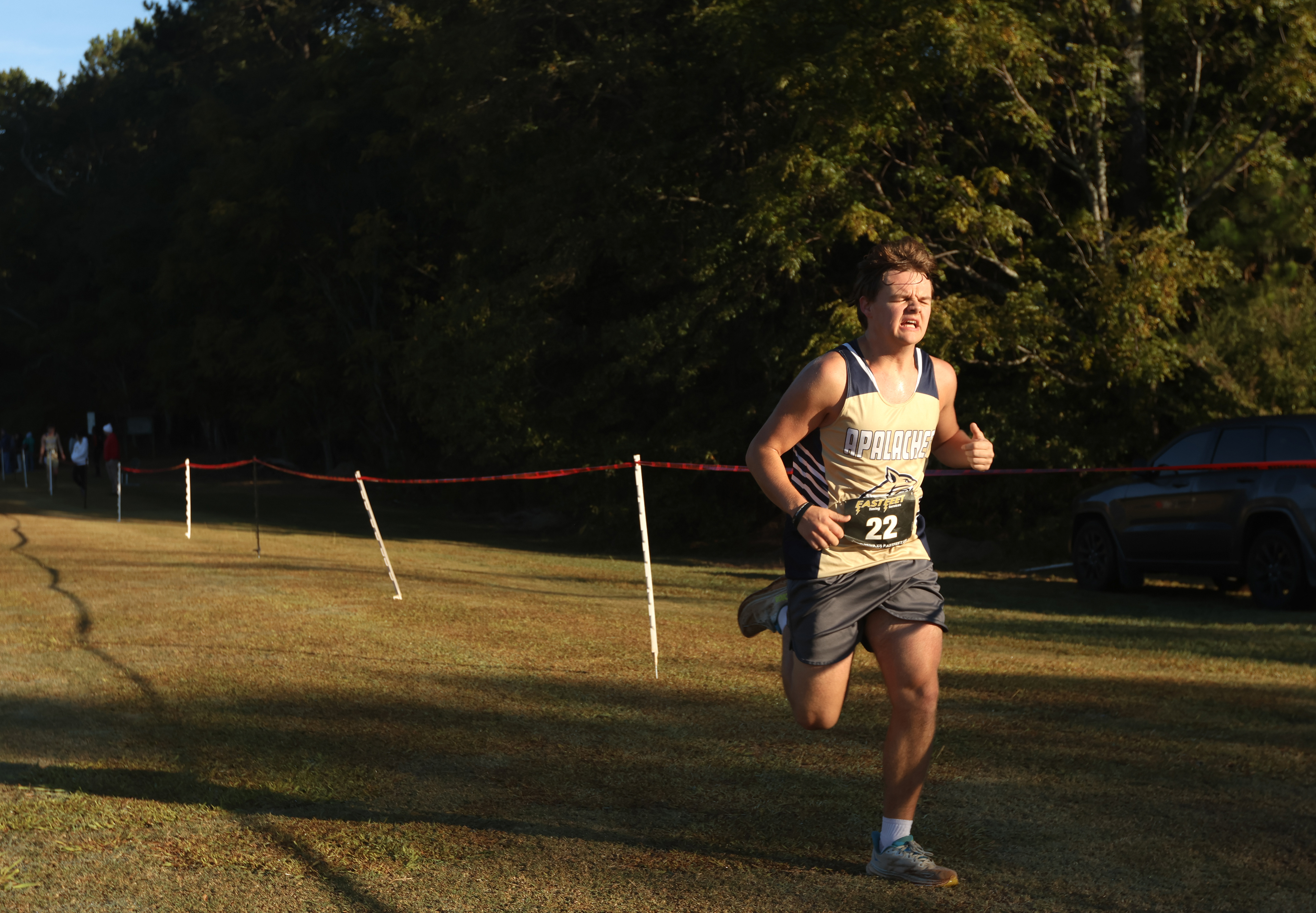 Austin Pruitt of Apalachee high school, 11th grade, sprints to the finish line in the Men's Varsity 5k at the North Oconee Cross Country Invitational on Oct. 19, 2024.