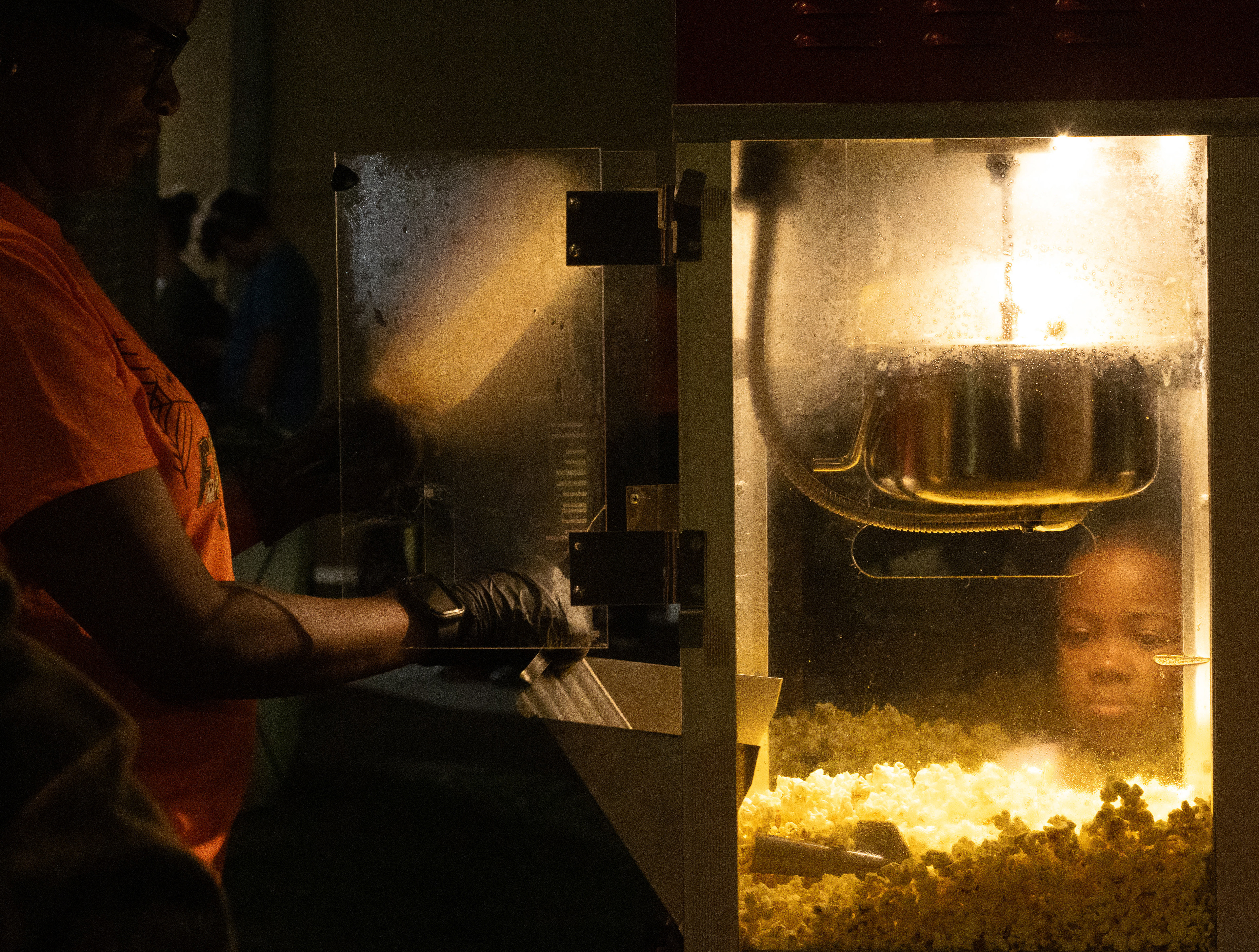 Naveigh Sheats waits for a bag of popcorn served by a volunteer at the third annual fall festival hosted by the Clark County Sheriff's Office on Oct. 25, 2024. Sheats is the son of a Clark-County police officer. 