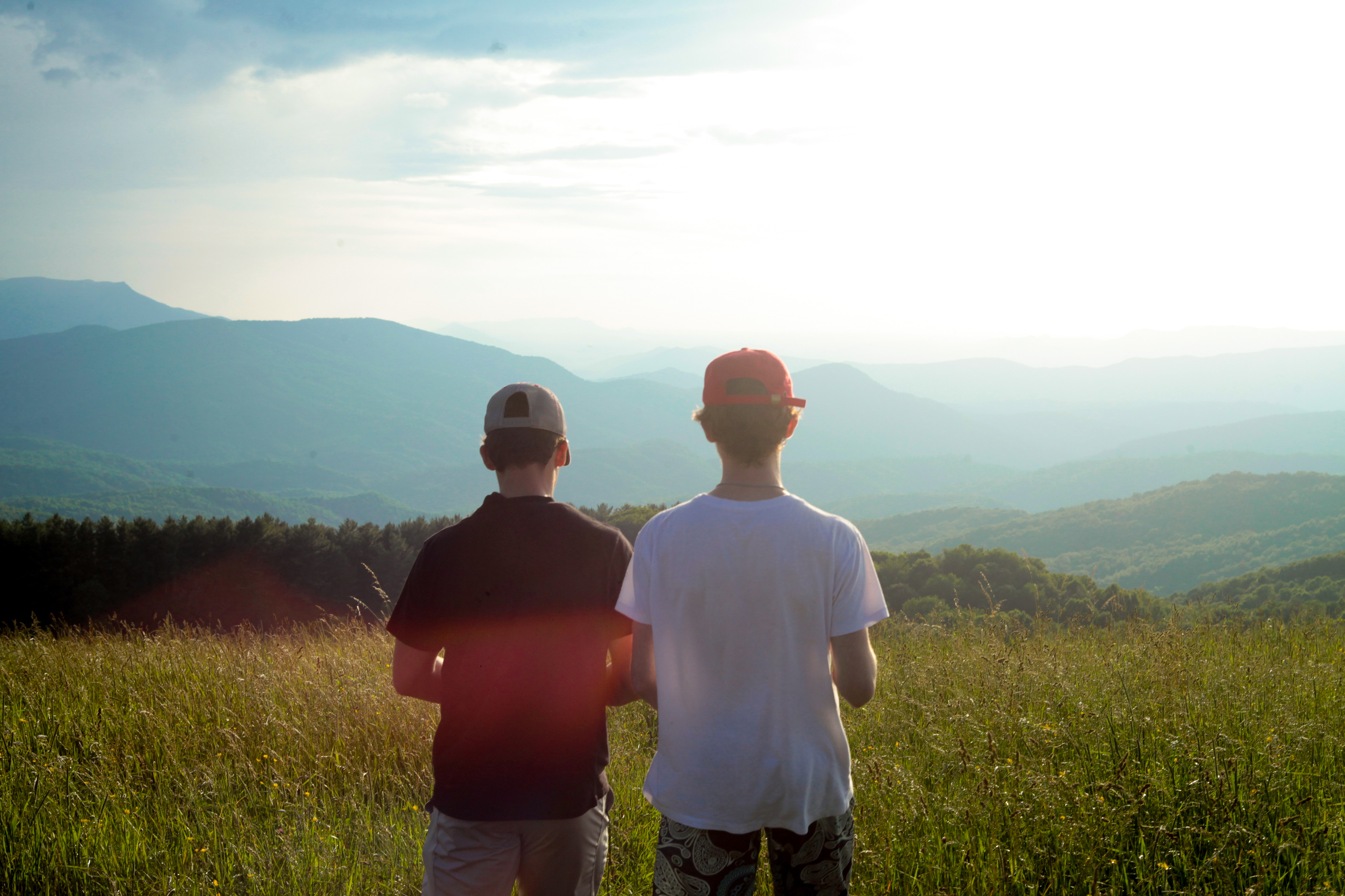 From left: Alec Colon and Ethan Schloss admire the view of the mountain range on June 30, 2021 at Max Patch trail in North Carolina.