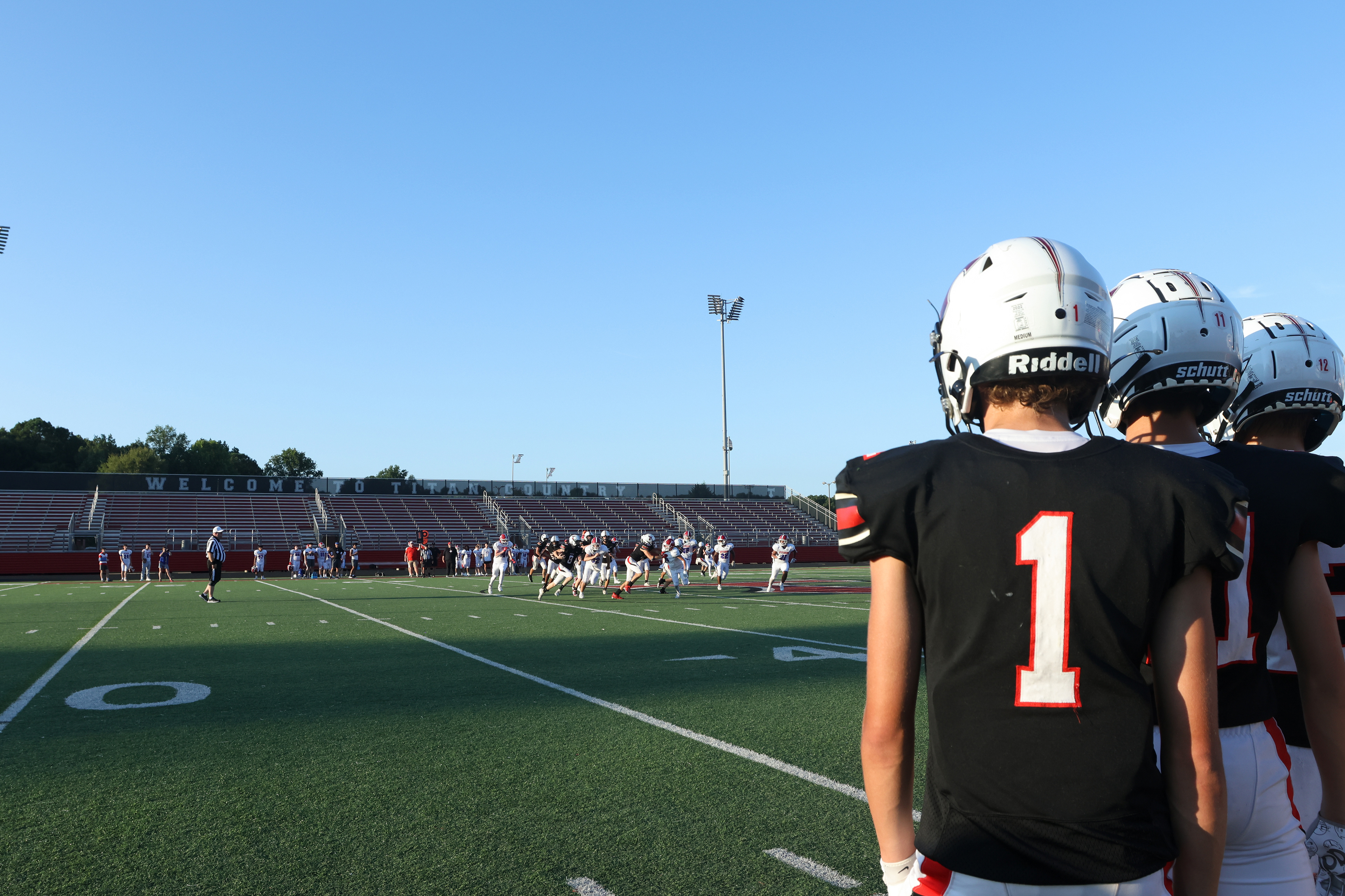 Ninth grade North Oconee football players watch as North's offense drives the ball down the field at home on Sept. 19, 2024. 