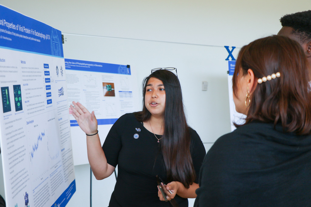 J. Mendez with her poster on viral protein structural studies