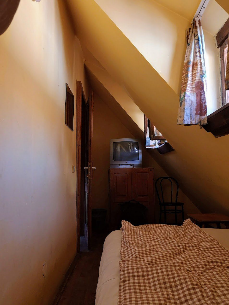 The tiniest room in which I slept while traveling throughout Romania. Very comfortable with a great view!