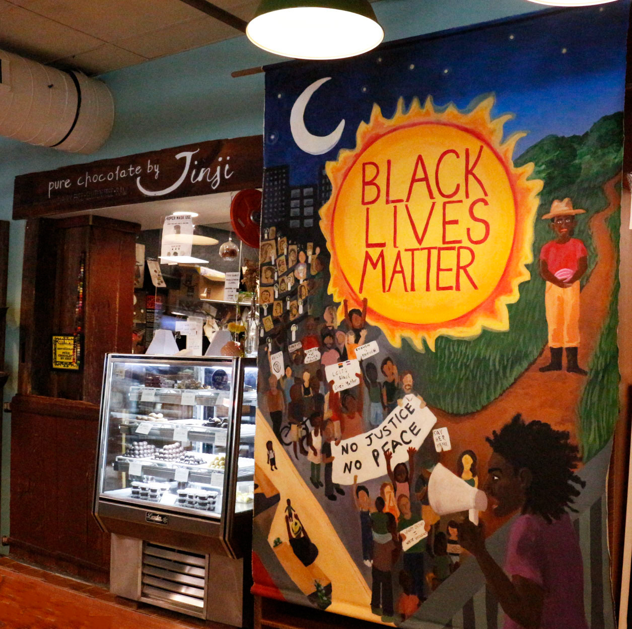 Large BLM banner done for Pure Chocolate by Jinji. The painting was done in collaboration with Georgia Beatty