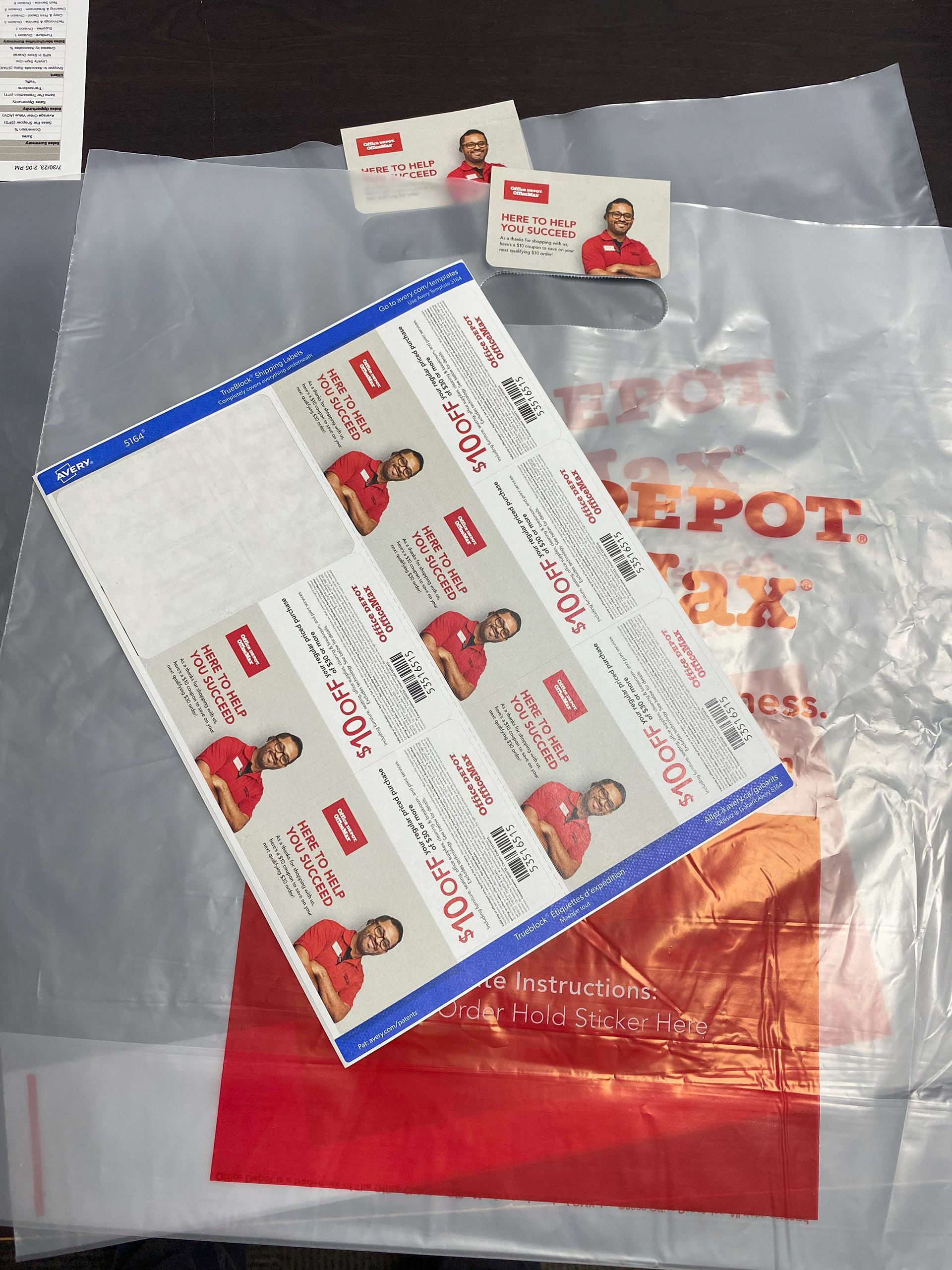 Top view of Avery Label 6up sheet with coupon stickers attached to pickup bags.