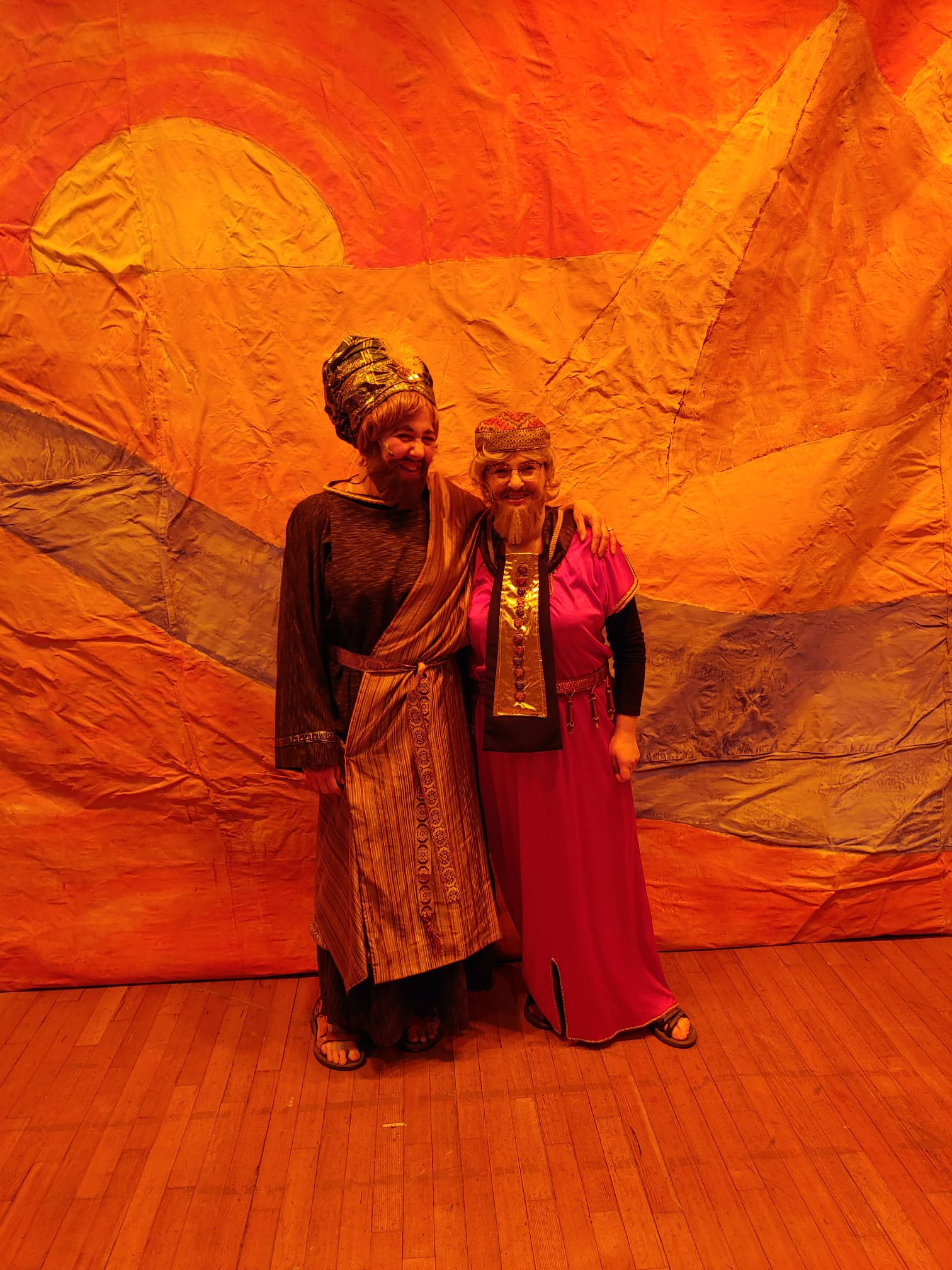 Cast members against vibrant back-drop