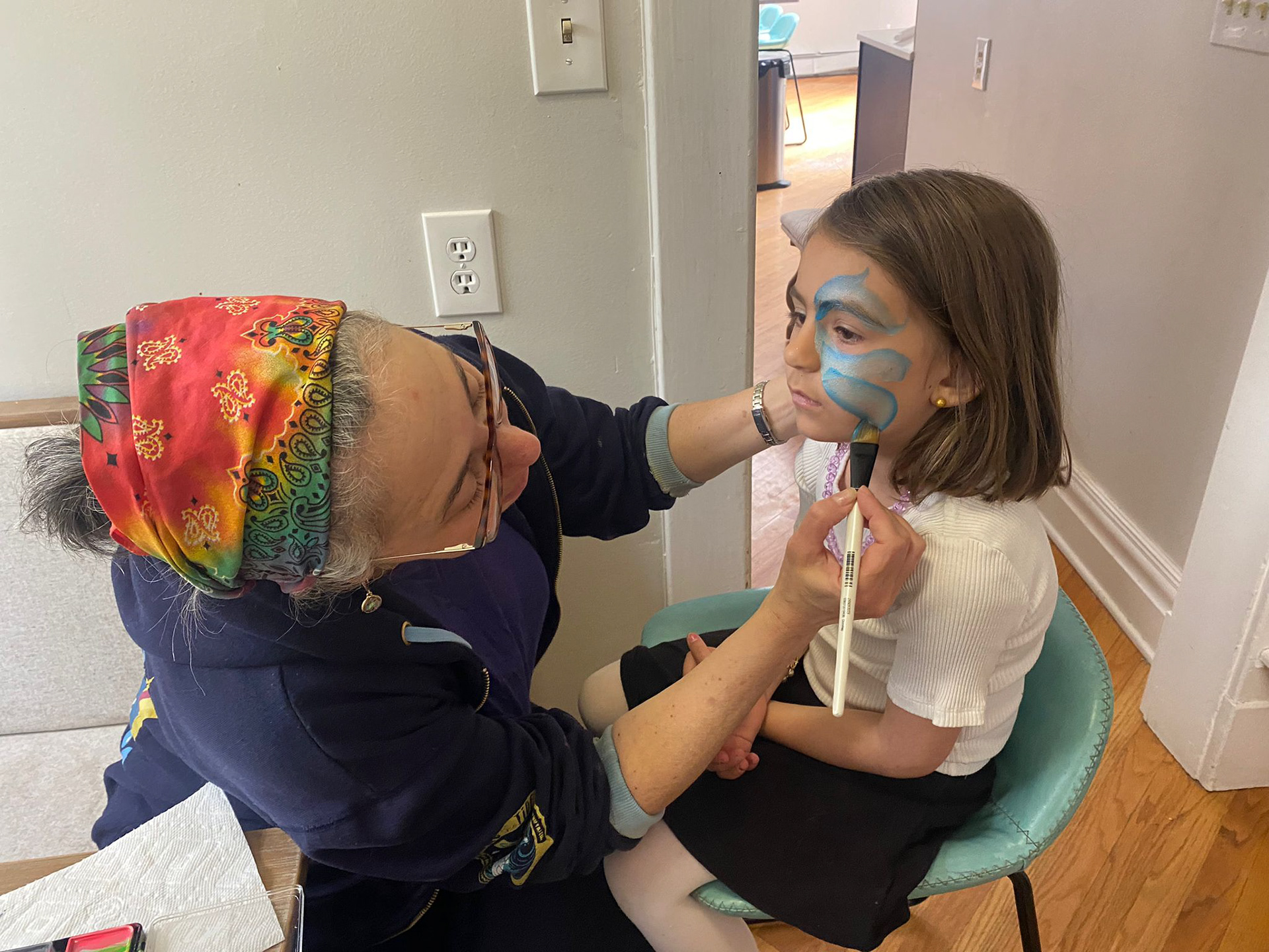 Face-painting at a private birthday party