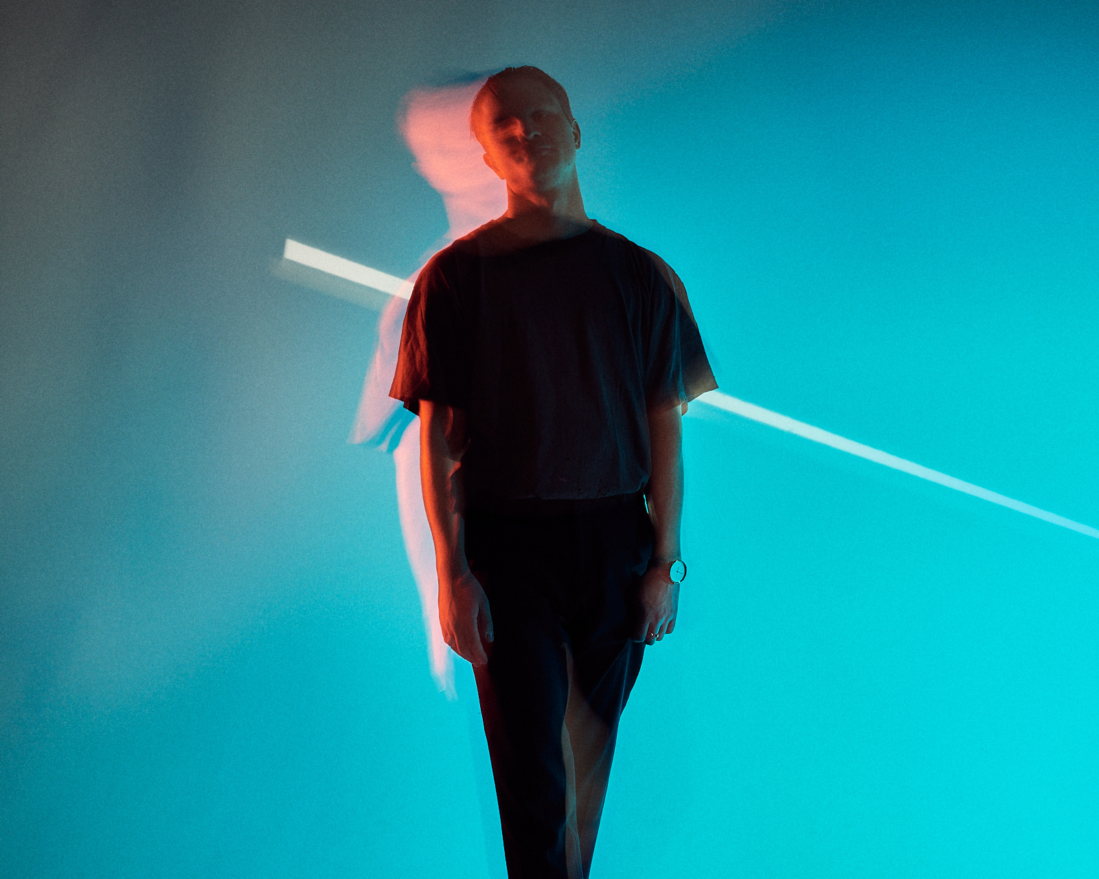 Portrait of a Man in front of blue Background
