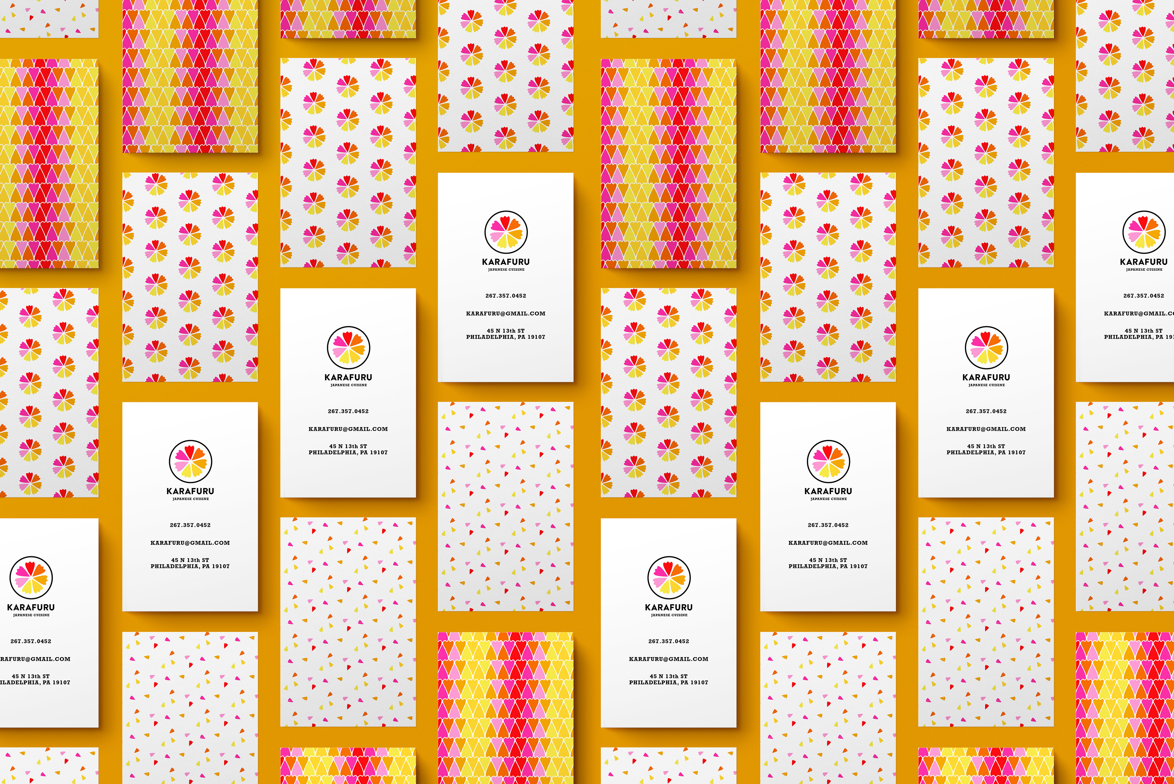 Multiple business cards organized in a pattern showcasing the info and the patterns on each side.