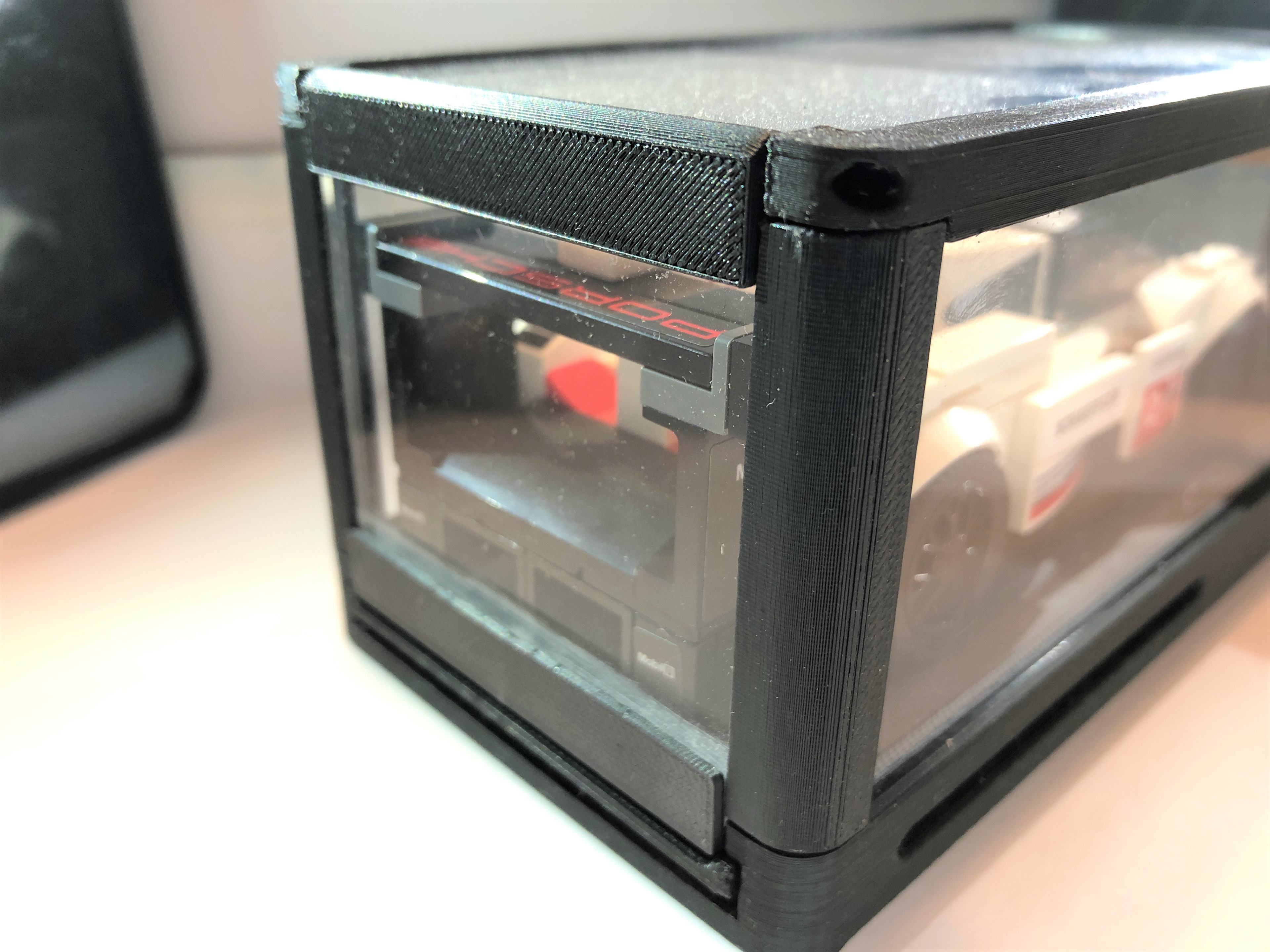 The rear corner showing the hinge and flush transparent door