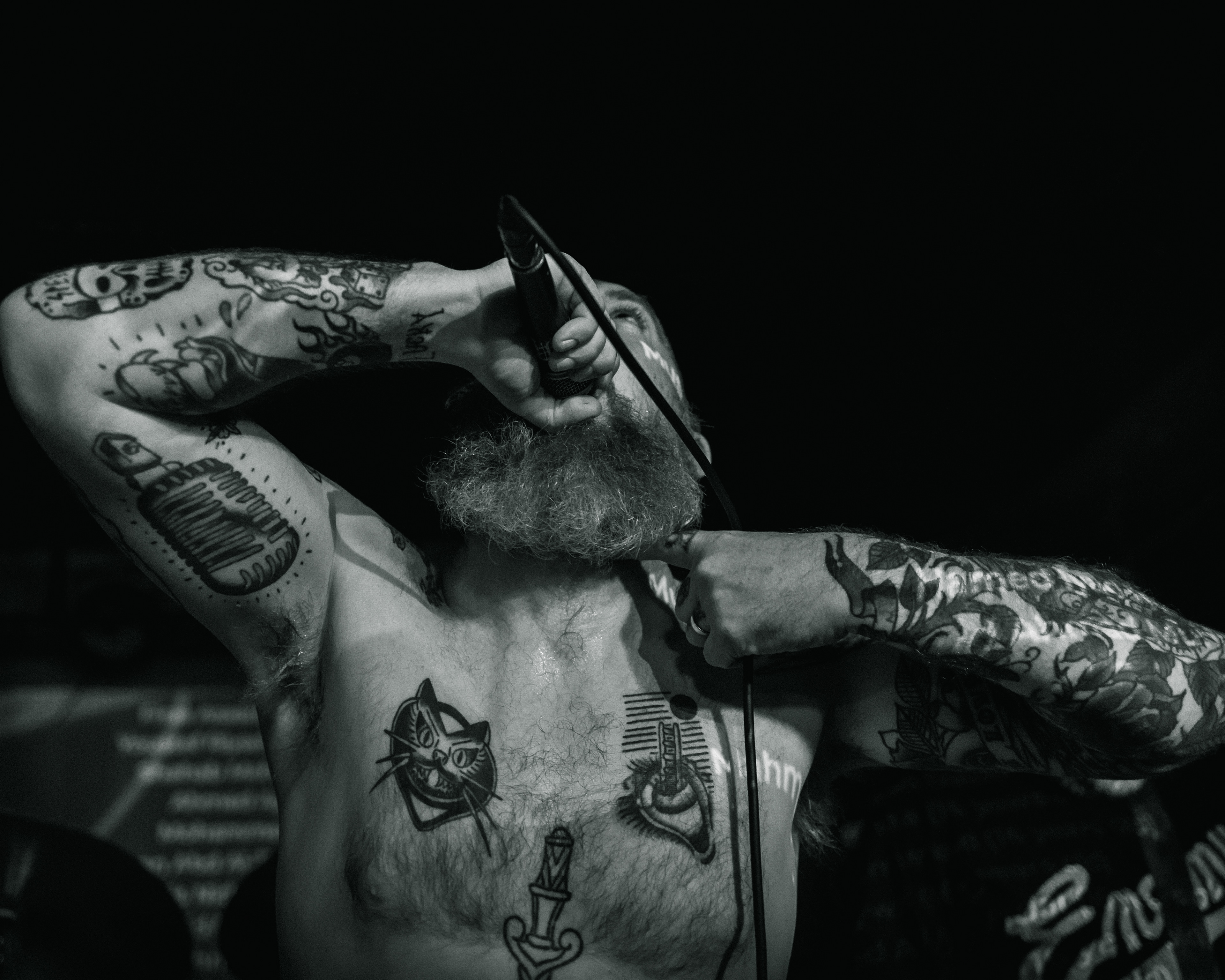 Balkan - Astoria - Vancouver -The vocalist sings while making a gesture across his neck 