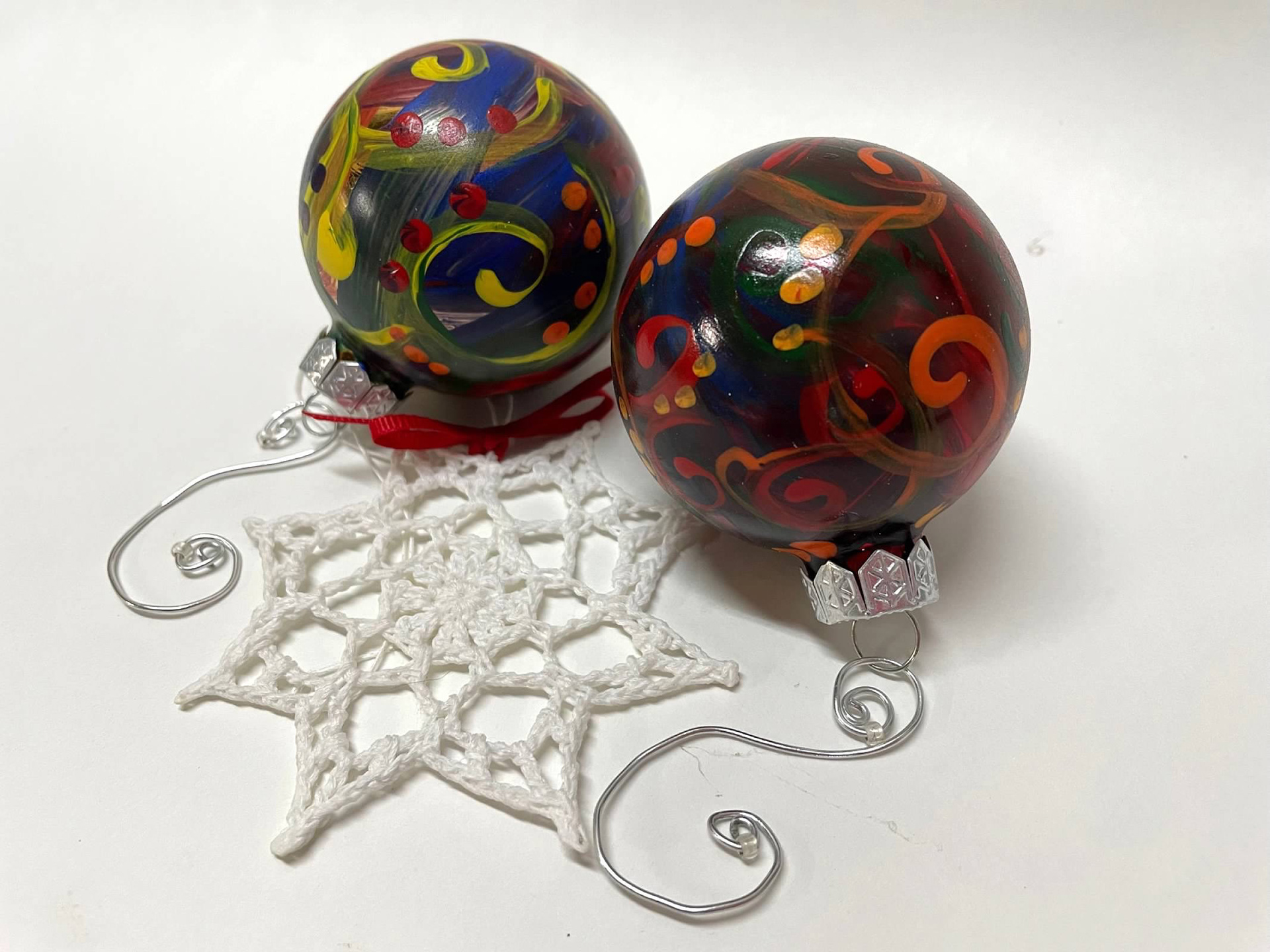Ornaments. Glass spheres. Crochet snowflakes. 