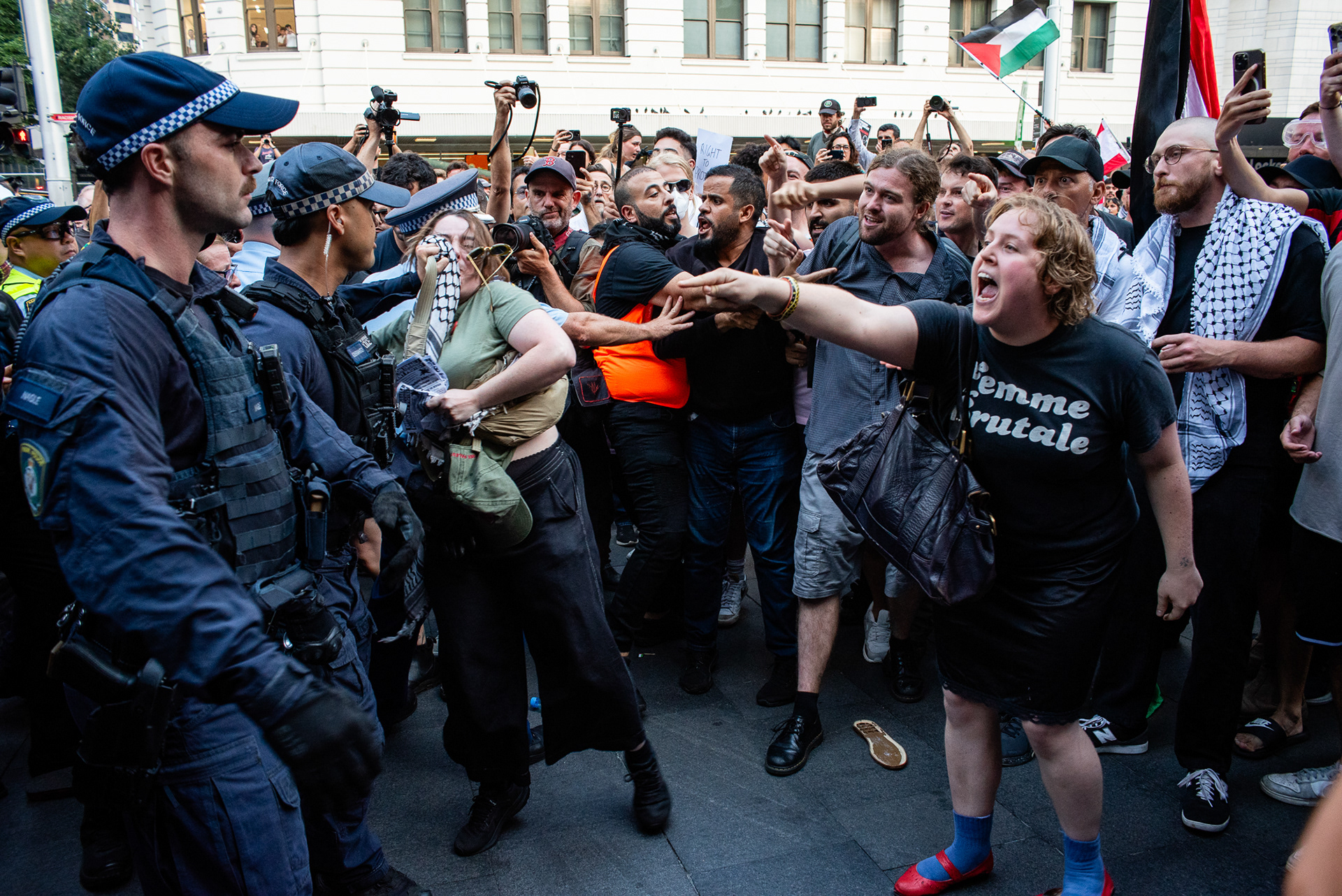 Sydney, Australia. 9 February 2026. A protester confronts NSW Police, pointing and shouting “Let us march” during a protest against the visit of Israeli President Isaac Herzog at Sydney Town Hall.