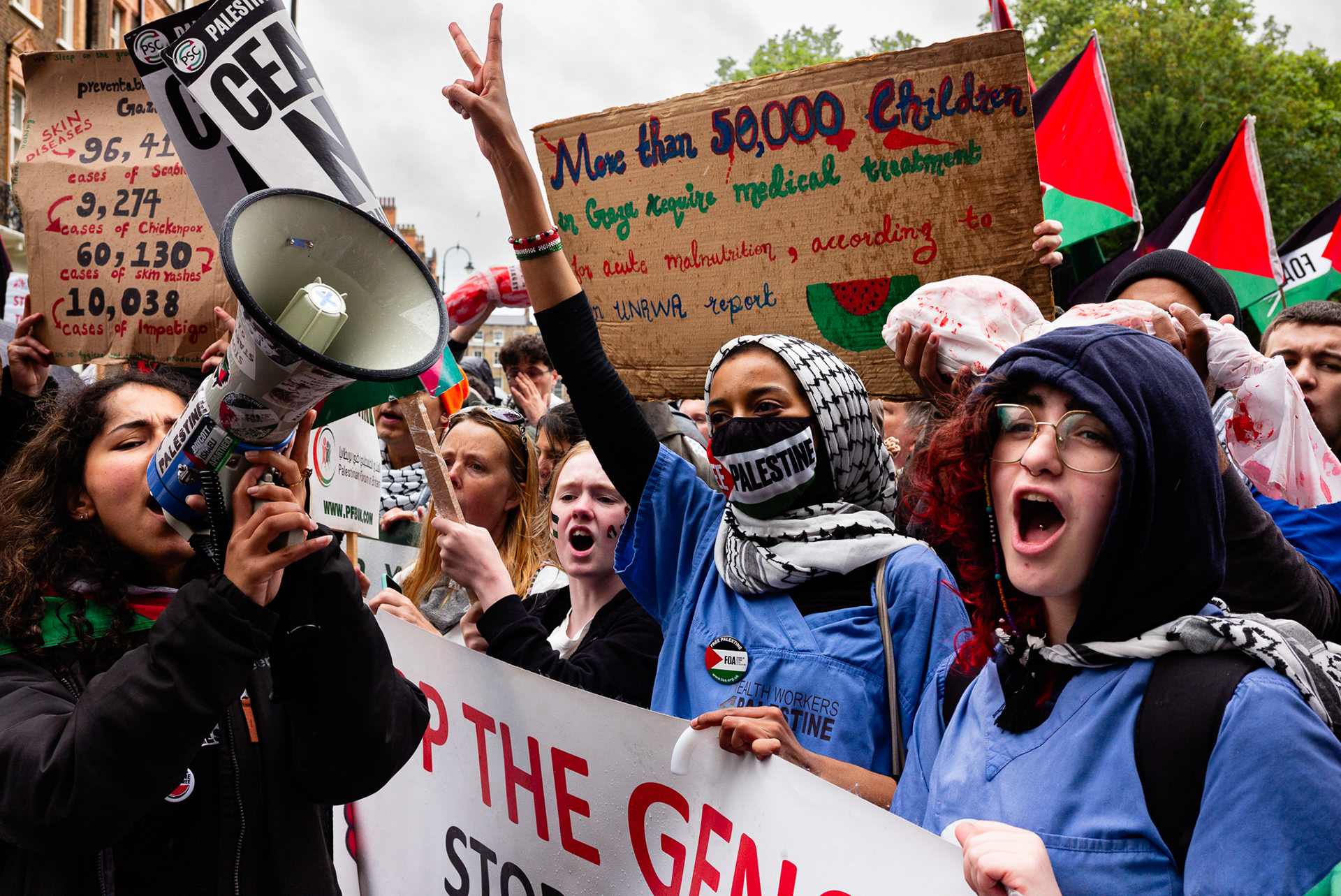 London, UK. 6th July, 2024. Members of Health Workers 4 Palestine hold banners, plackards and Palestine glags during the National March for Palestine, organised by the Palestine Solidarity Campaign (PSC) and other partner organisations to protest the ongoing military action in Gaza, to call for a ceasefire, and express solidarity with Palestine.