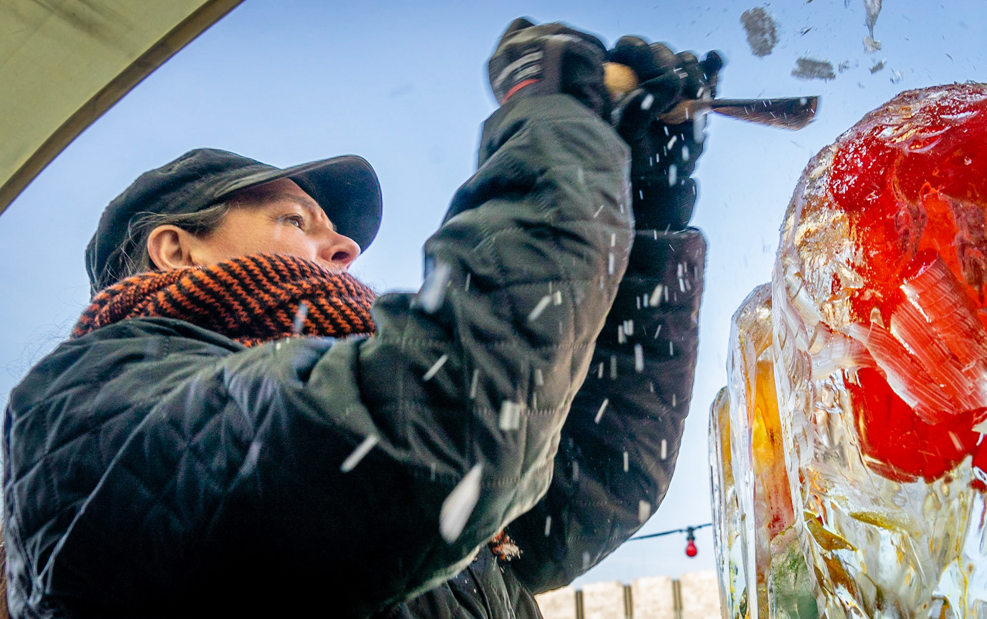 Sculptor/Painter Susanne Ahrenkiel turing ice into flowers