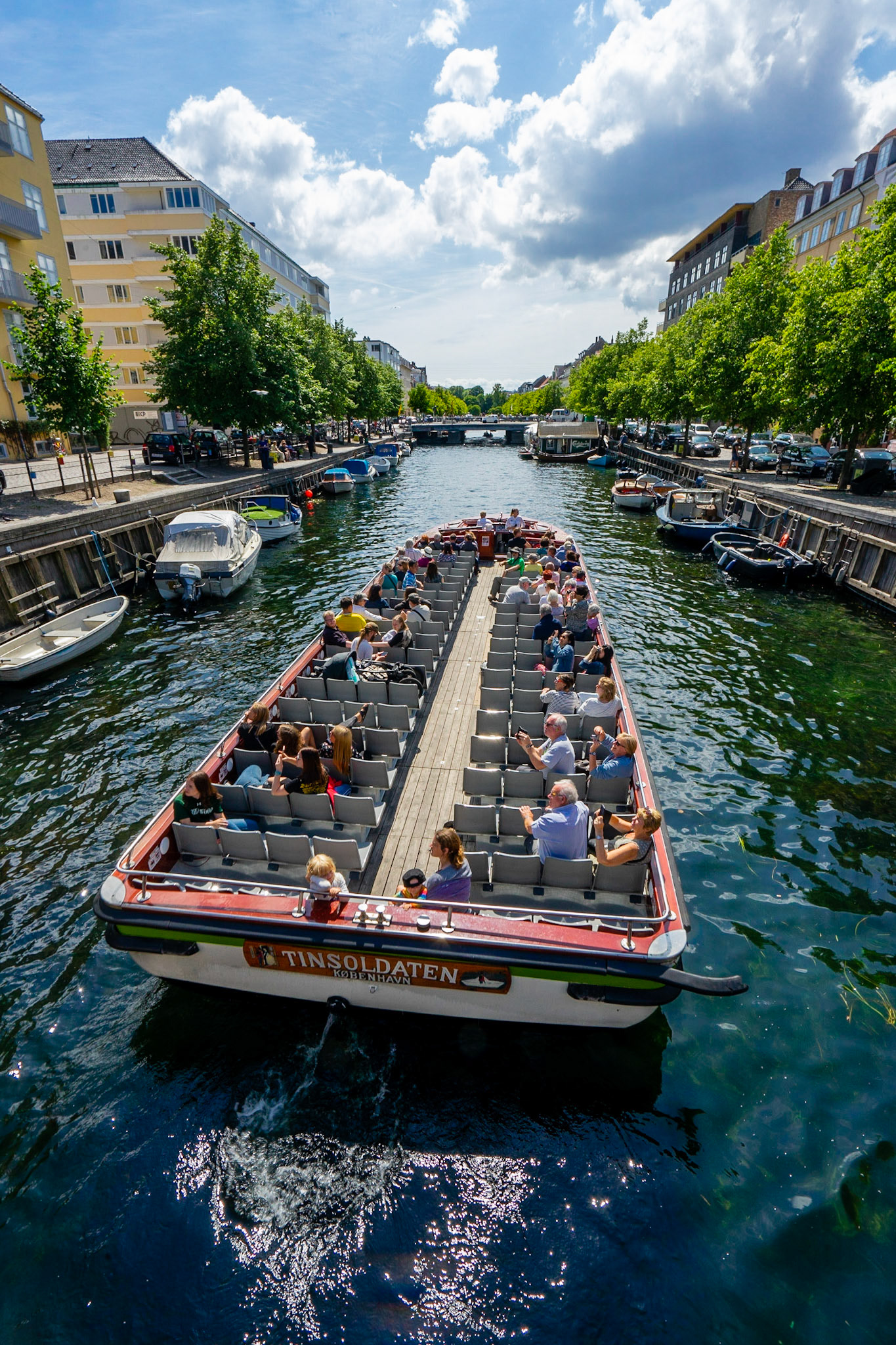 Copenhagen canal tour boat in one of the canals in Christianshavn