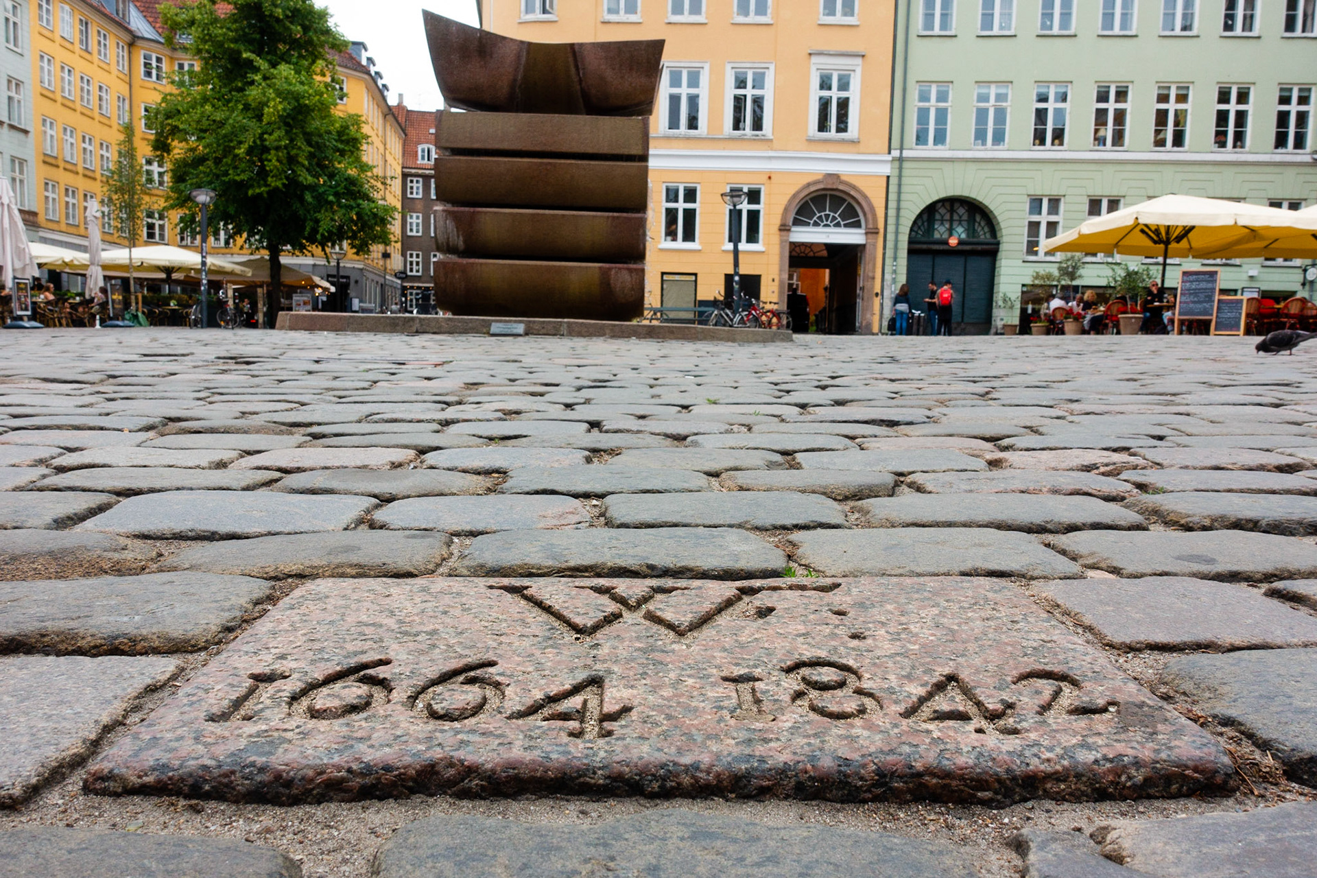 Stone in the pavement where the pillory over Danish traitor Corfitz Ulfeldt was erected on Gråbrødretorv, with the inscription "WF 1664-1842"