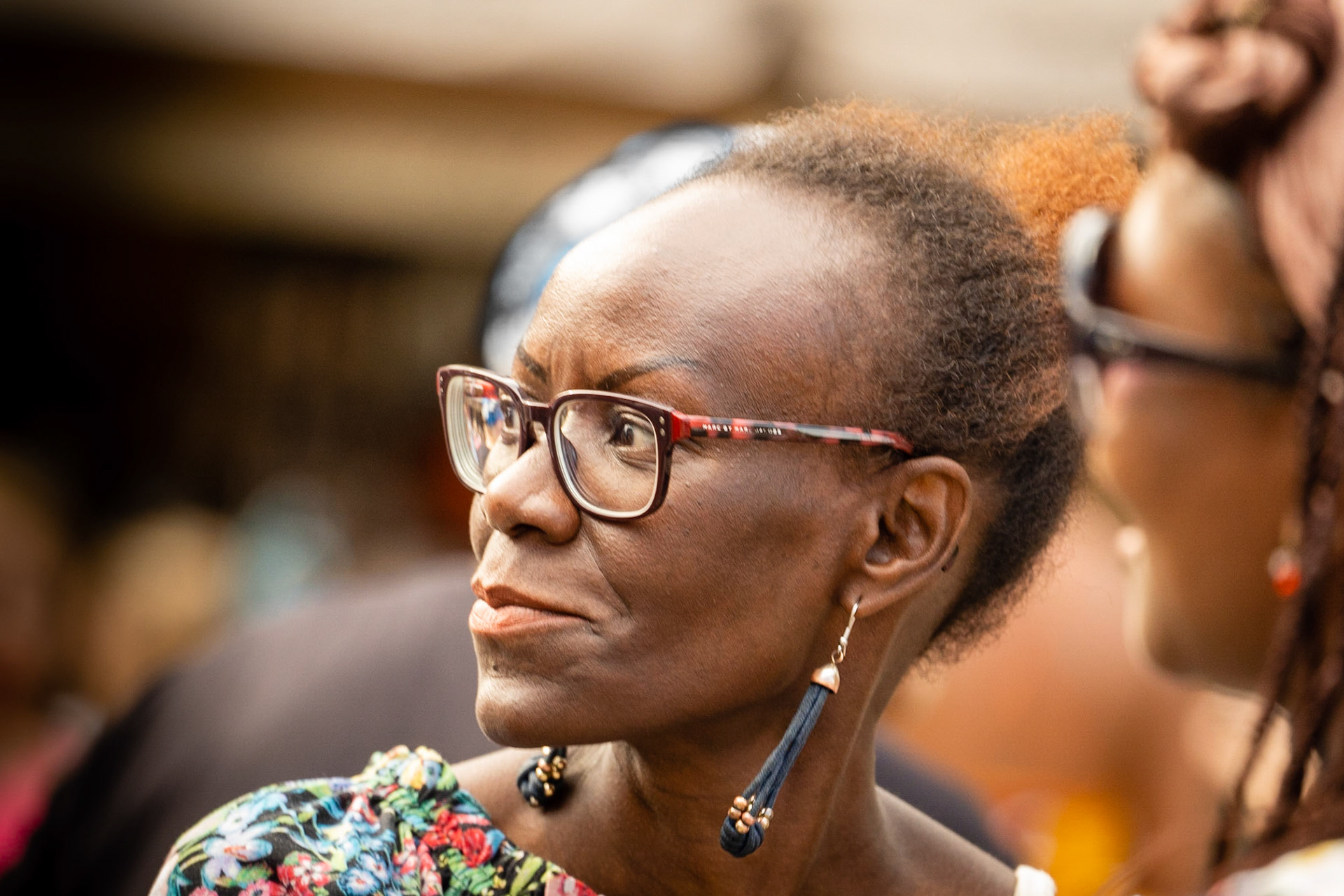 Woman of African origin with glasses and ear pendants at Couleur Cafe 2018 in Copenhagen