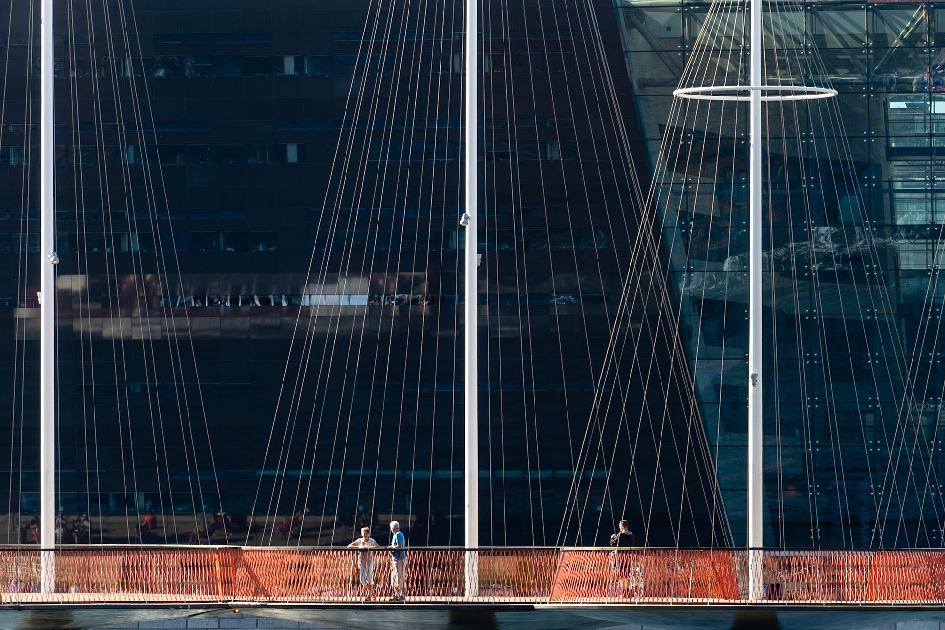 People on (Circle Bridge) in Copenhagn, architectural landmark by artist Olafur Eliasson,