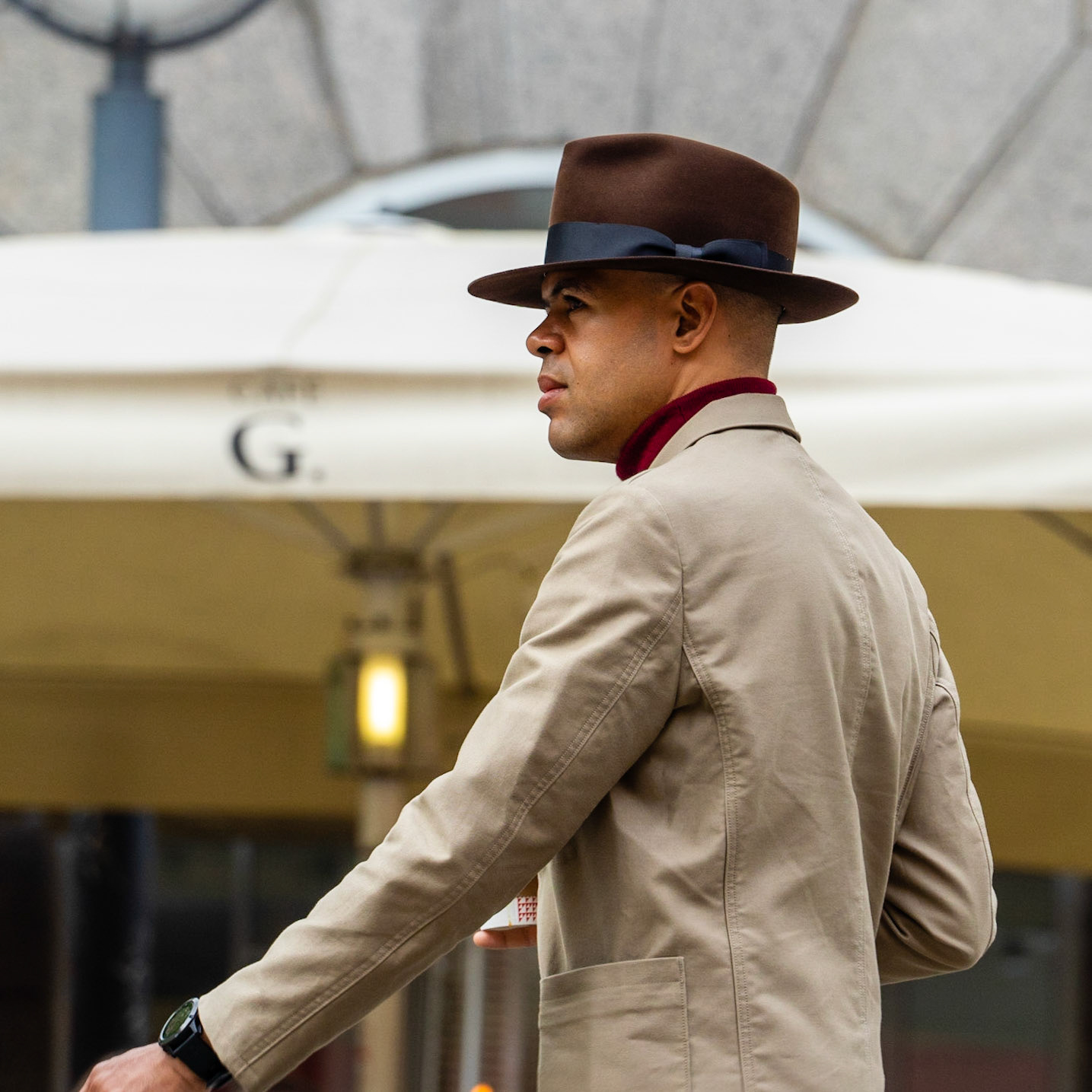 Well-dressed, well-groomed gentleman in suit and brown fedora