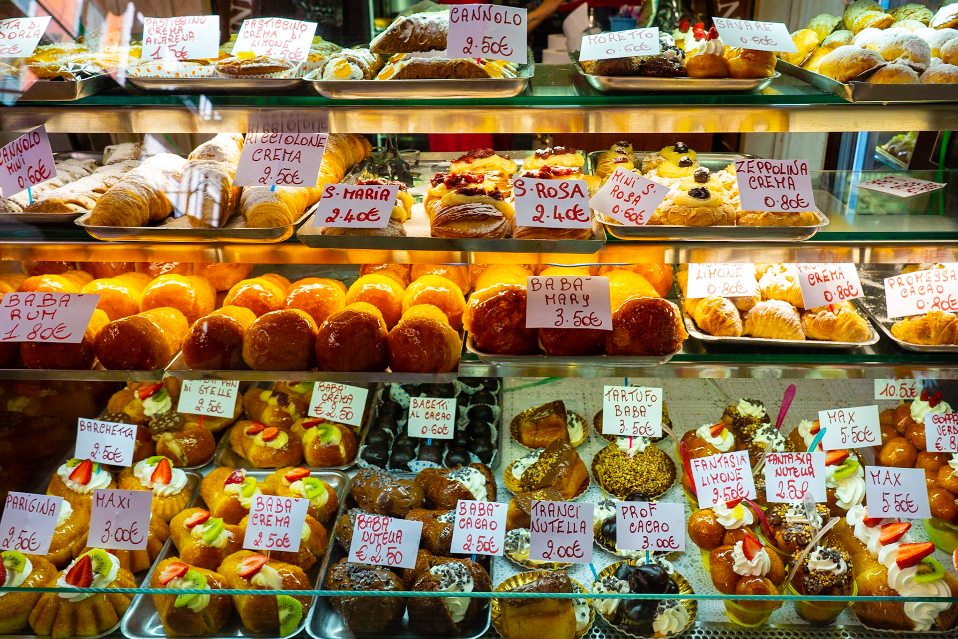 Italian cakes and pastry in Naples city centre, e.g. baba rum, cannolo, zeppolina, bagetti, tartufo, santa maria, santa rosa