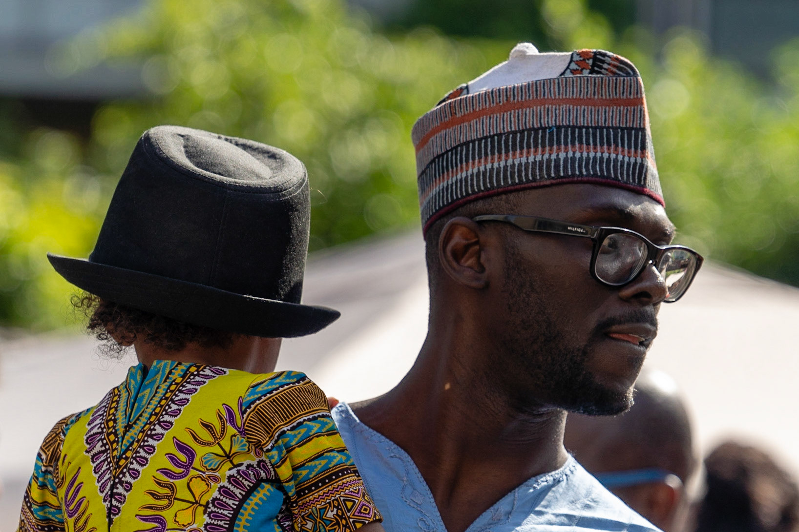 Father of African origin with son wearing fedora at Coleur Cafe 208 in Copenhagen
