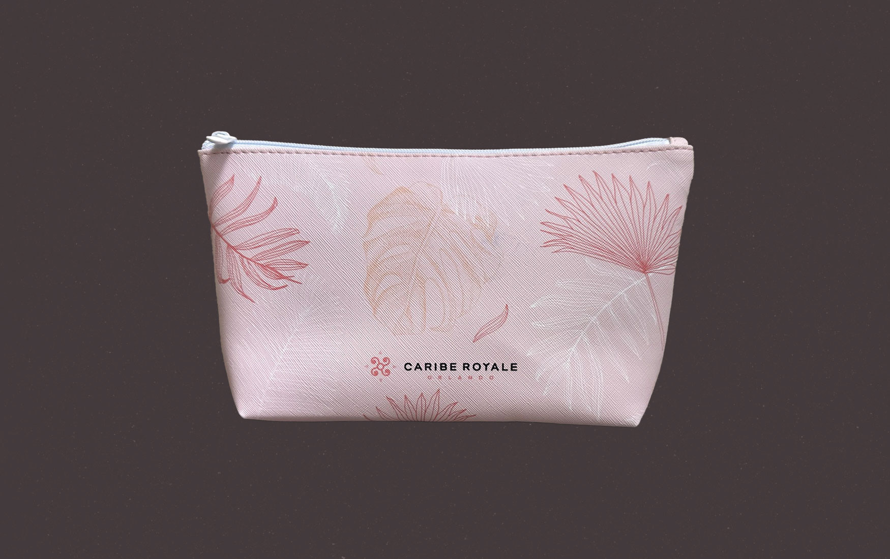 Cosmetics bag with a leaf design and the Caribe Royale Orlando logo.