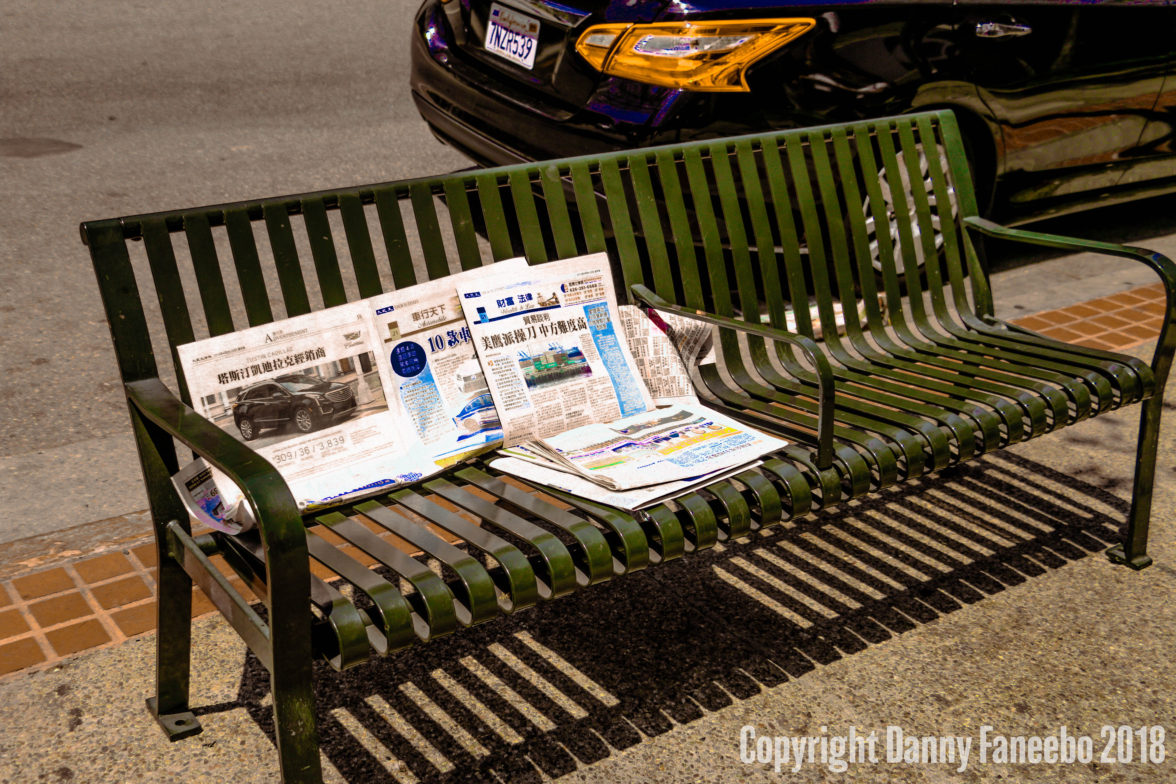 Newspapers on bench - Chinatown, LA - 2018