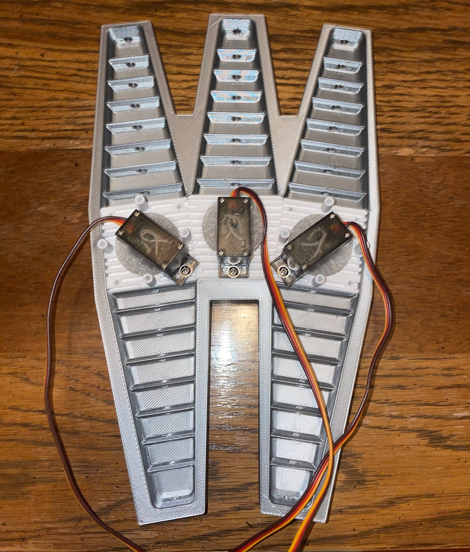 Completed mold with Tri-hub and servos fully seated; ready for silicone pouring.