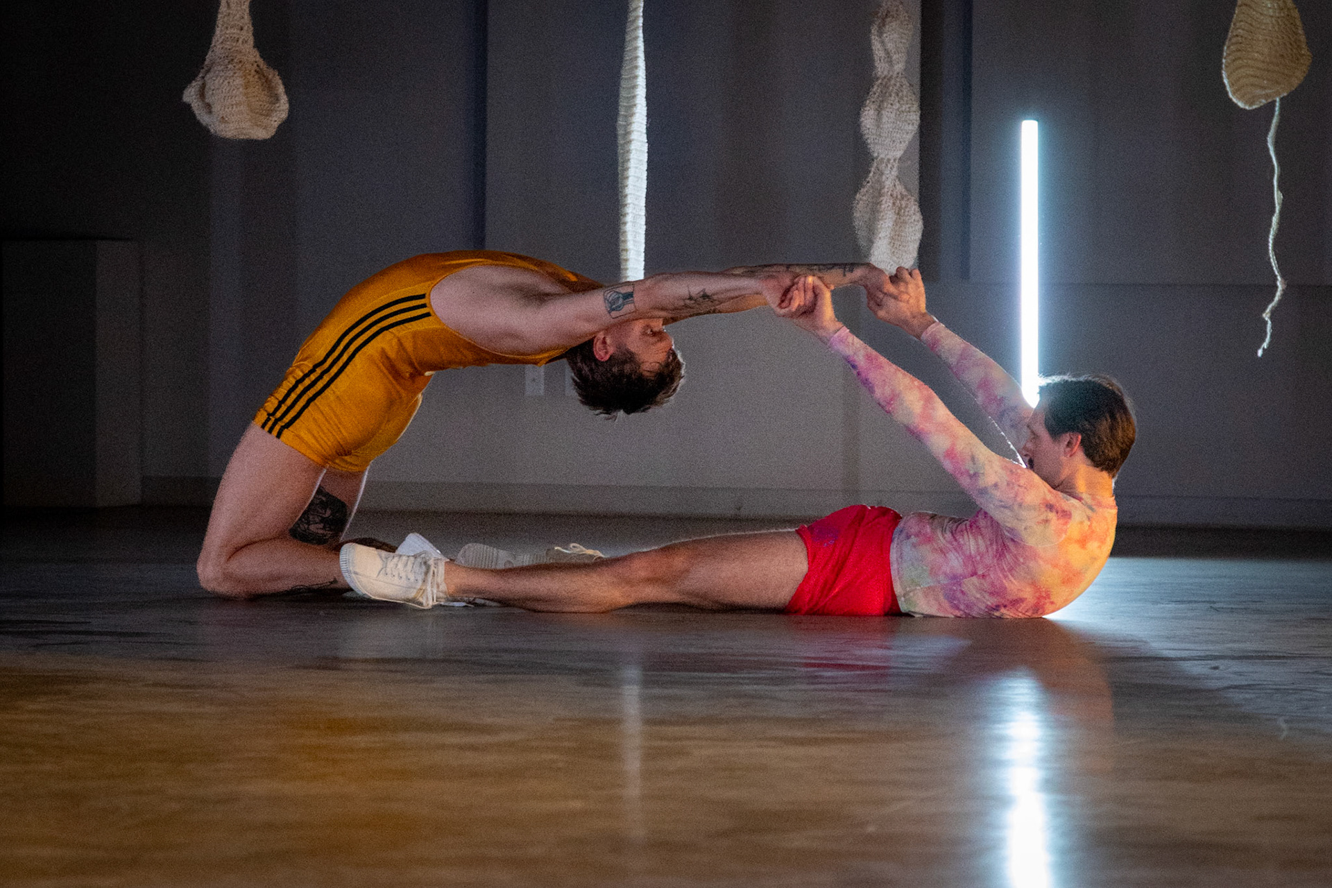 On April 11, 2025, at Cove Street Arts in Portland, Maine, “Bunk Beds” unfolded as an intimate, physical meditation on queer longing, devotion, and choreographic legacy. Directed by Tristan Koepke and created in collaboration with James Barrett, Emilia Bruno, Marc Macaranas, Daniel Miramontes, Benny Olk, and Curtis Thomas, the performance drew on the lives and love of Merce Cunningham and John Cage, Instagram thirst traps, and the radical possibilities of relationship anarchy.With live music composed and performed by Ethan Philbrick, lighting and production design by Audrey Kastner, and dramaturgy by Rebecca Steinberg, the piece layered movement, sound, and image into a performance that felt both deeply personal and expansively collective.