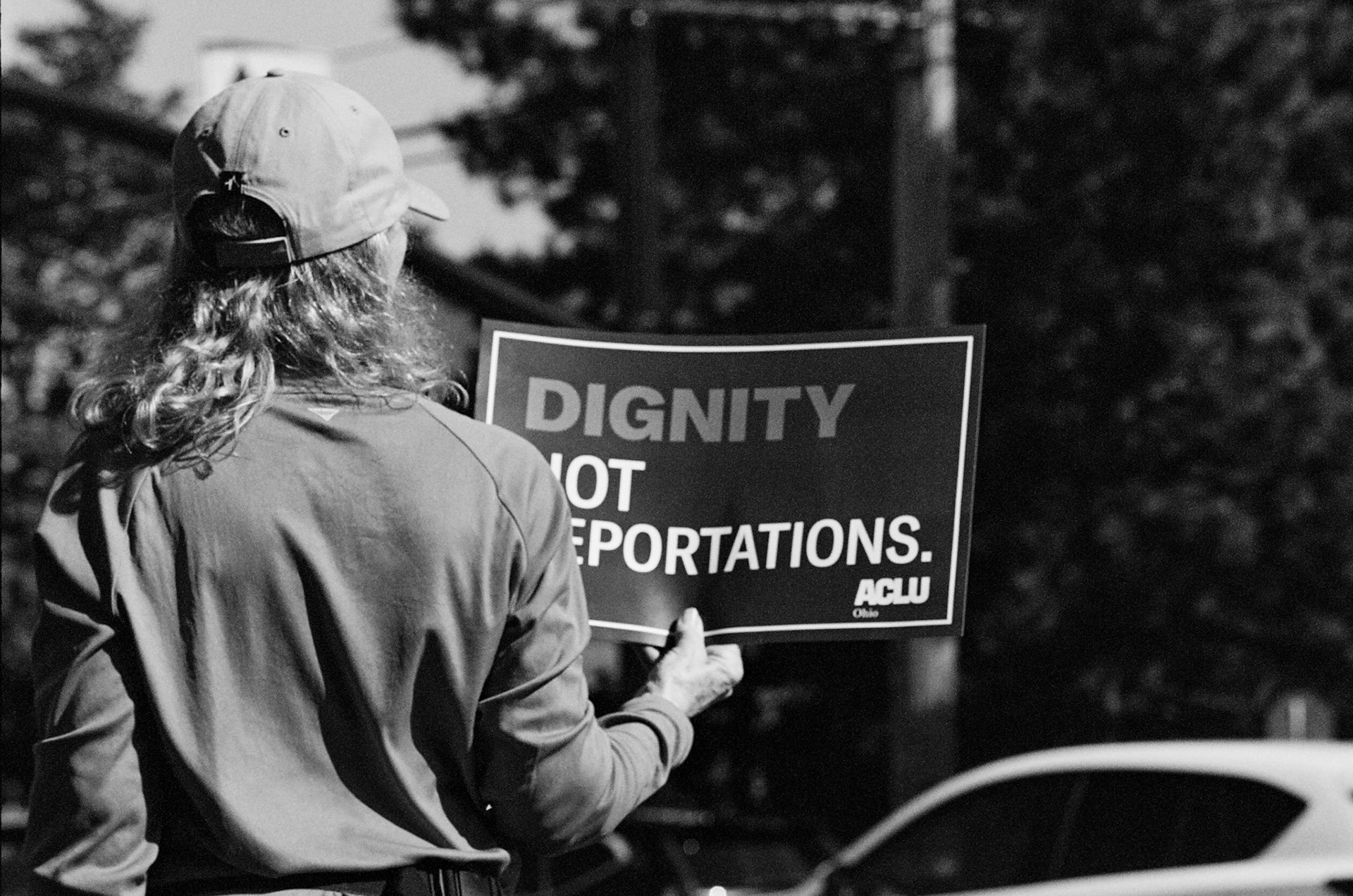 Protesters line SOM Center Road in Solon, OH on October ## 2025 to demonstrate against the Trump presidency and newly implemented policies on immigration.