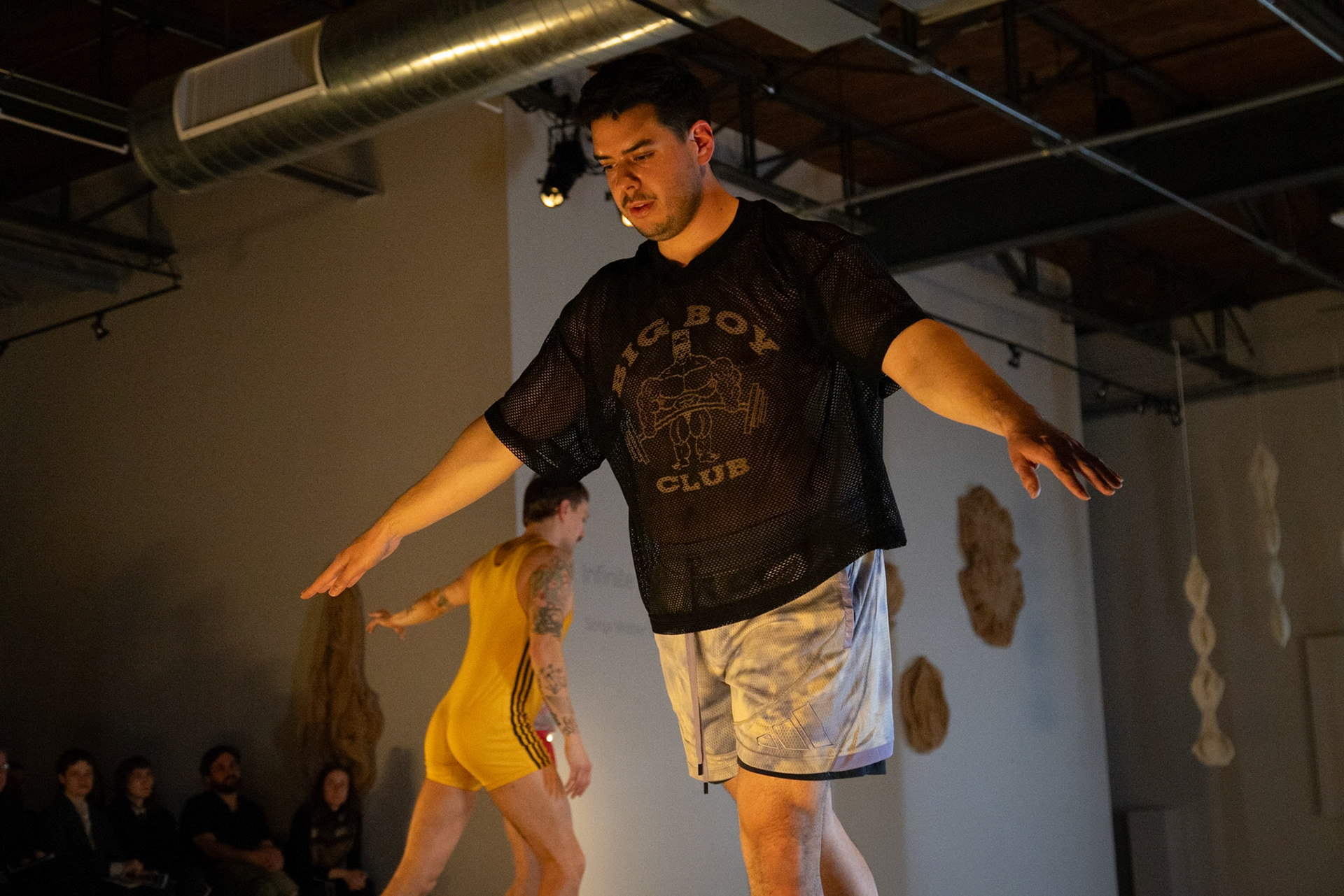 On April 11, 2025, at Cove Street Arts in Portland, Maine, “Bunk Beds” unfolded as an intimate, physical meditation on queer longing, devotion, and choreographic legacy. Directed by Tristan Koepke and created in collaboration with James Barrett, Emilia Bruno, Marc Macaranas, Daniel Miramontes, Benny Olk, and Curtis Thomas, the performance drew on the lives and love of Merce Cunningham and John Cage, Instagram thirst traps, and the radical possibilities of relationship anarchy.With live music composed and performed by Ethan Philbrick, lighting and production design by Audrey Kastner, and dramaturgy by Rebecca Steinberg, the piece layered movement, sound, and image into a performance that felt both deeply personal and expansively collective.