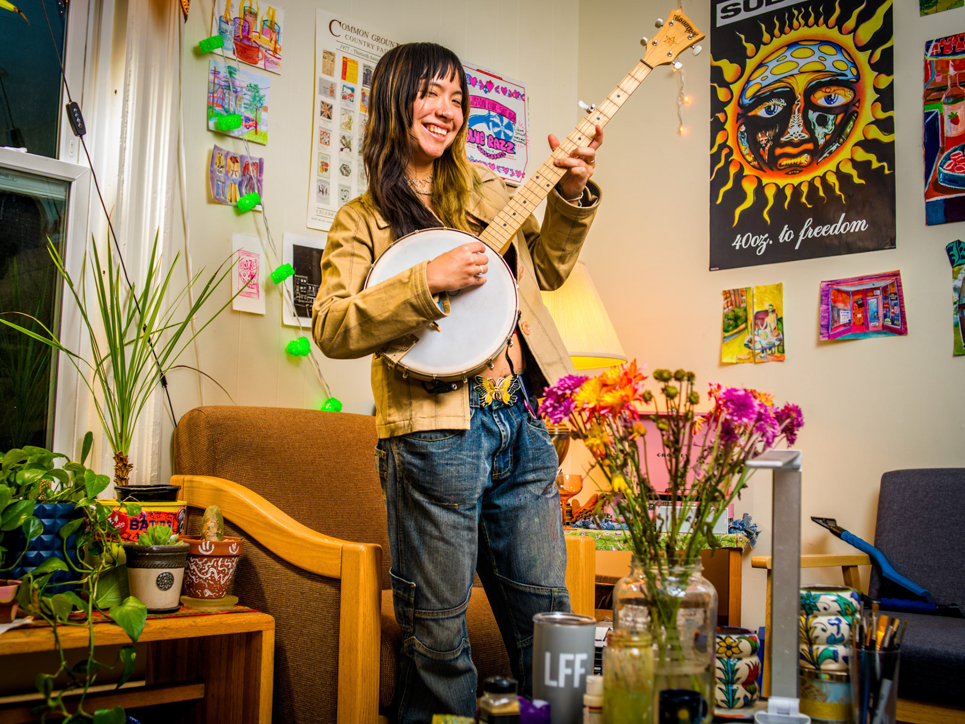 Lean Dockery '26 and Megan Billings '26 of Turner house on College Street show me their living space. The group (one not pictured) chose Turner as it is one of the few housing options which gave the group two floors of space while being located centrally on the Bates Campus near the historic quad. Music, Arts and Color is one of the guiding principals behind the design of the space. Dockery and Billings were excited to showcase the items held dear to each of them collected from their travels while attending Bates these past four years.
