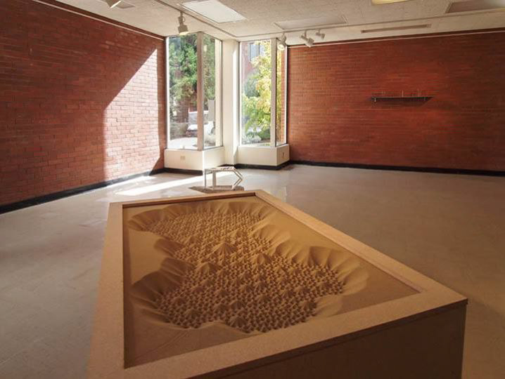 Desert Mandala Machine, 2014. Dimensions: 3' x 5' x 2'. Medium density fiberboard, sand.