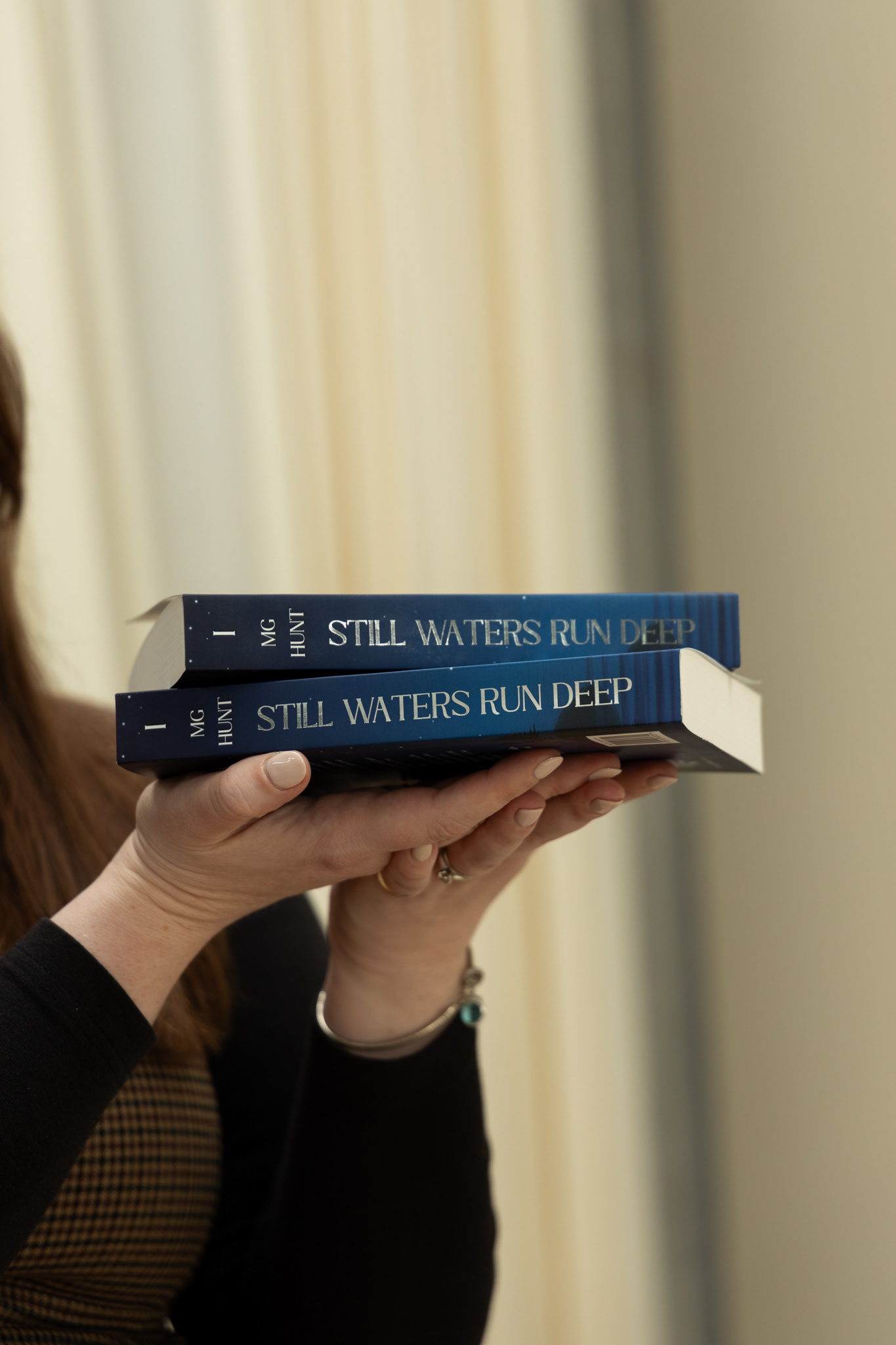 Still Waters Run Deep, paperback with silver foil on cover and spine.