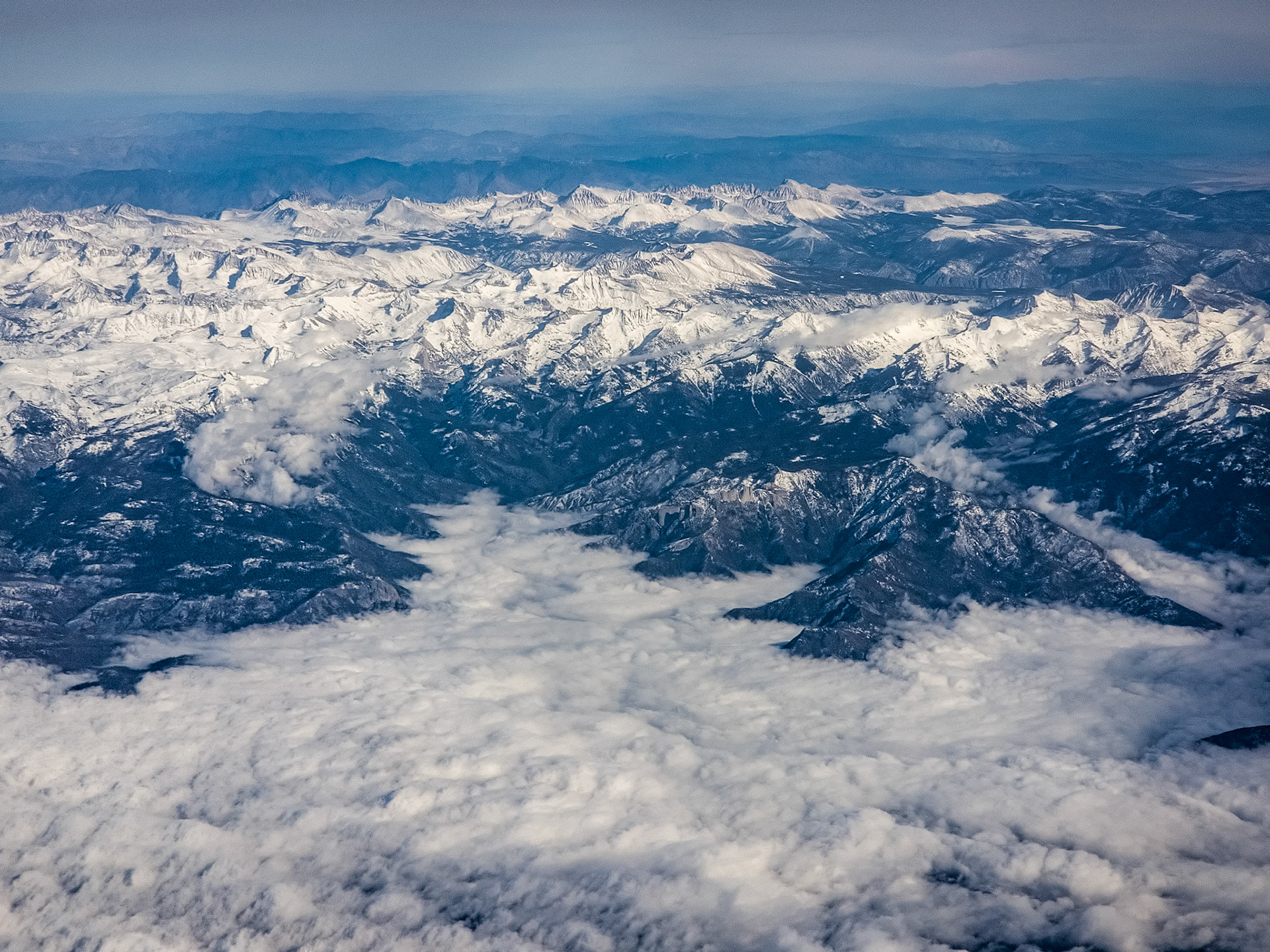 really low clouds dipping into the mountains
