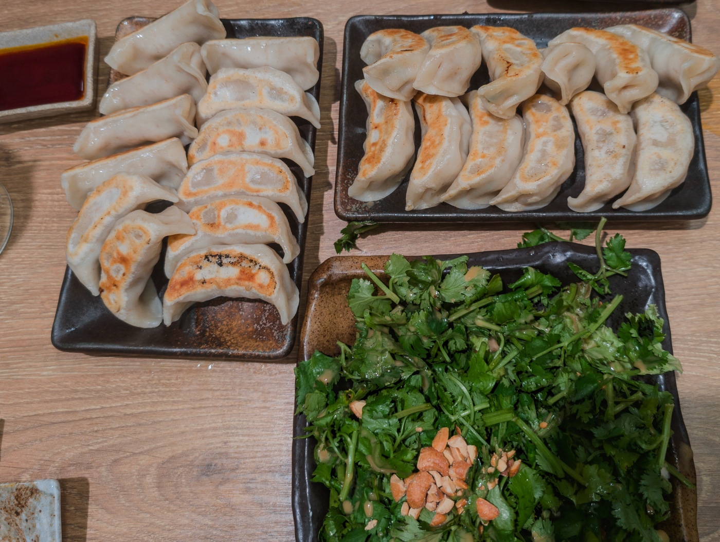 Gyoza and coriander peanut sesame salad