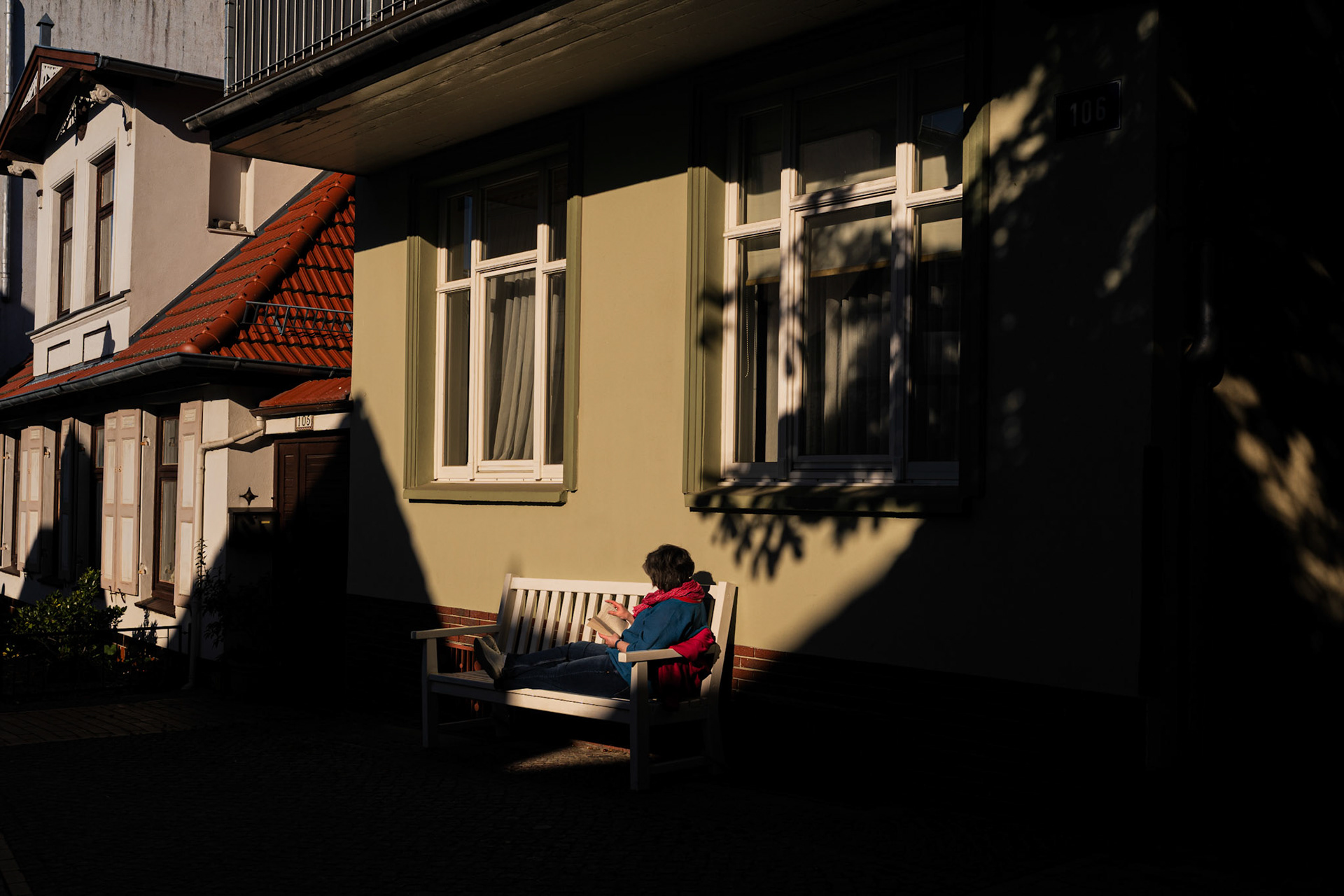 Reading book on bench