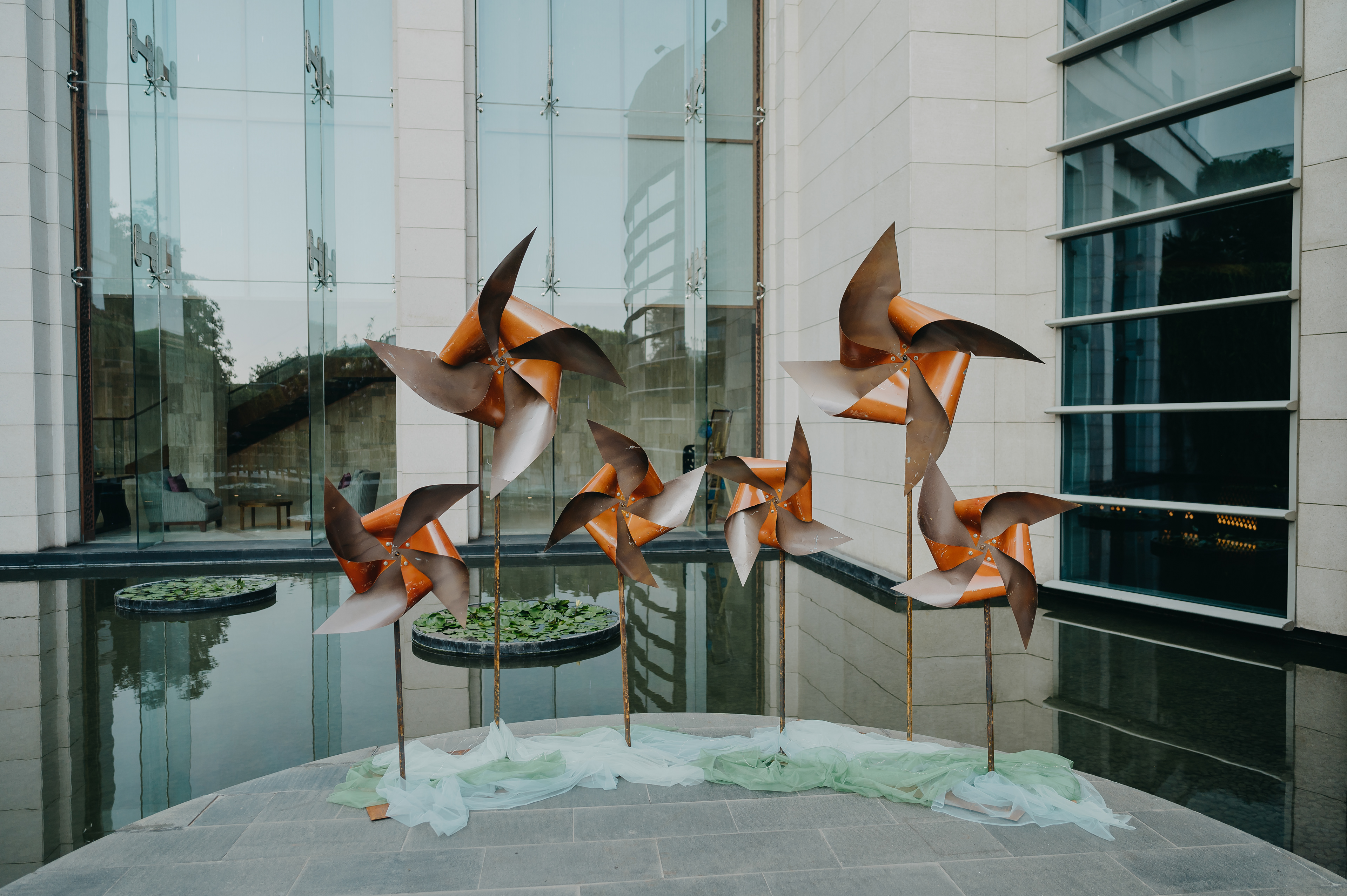 Outside the space was a water feature, where we installed giant spinning pinwheels that caught the breeze and spun, creating a dynamic feature.