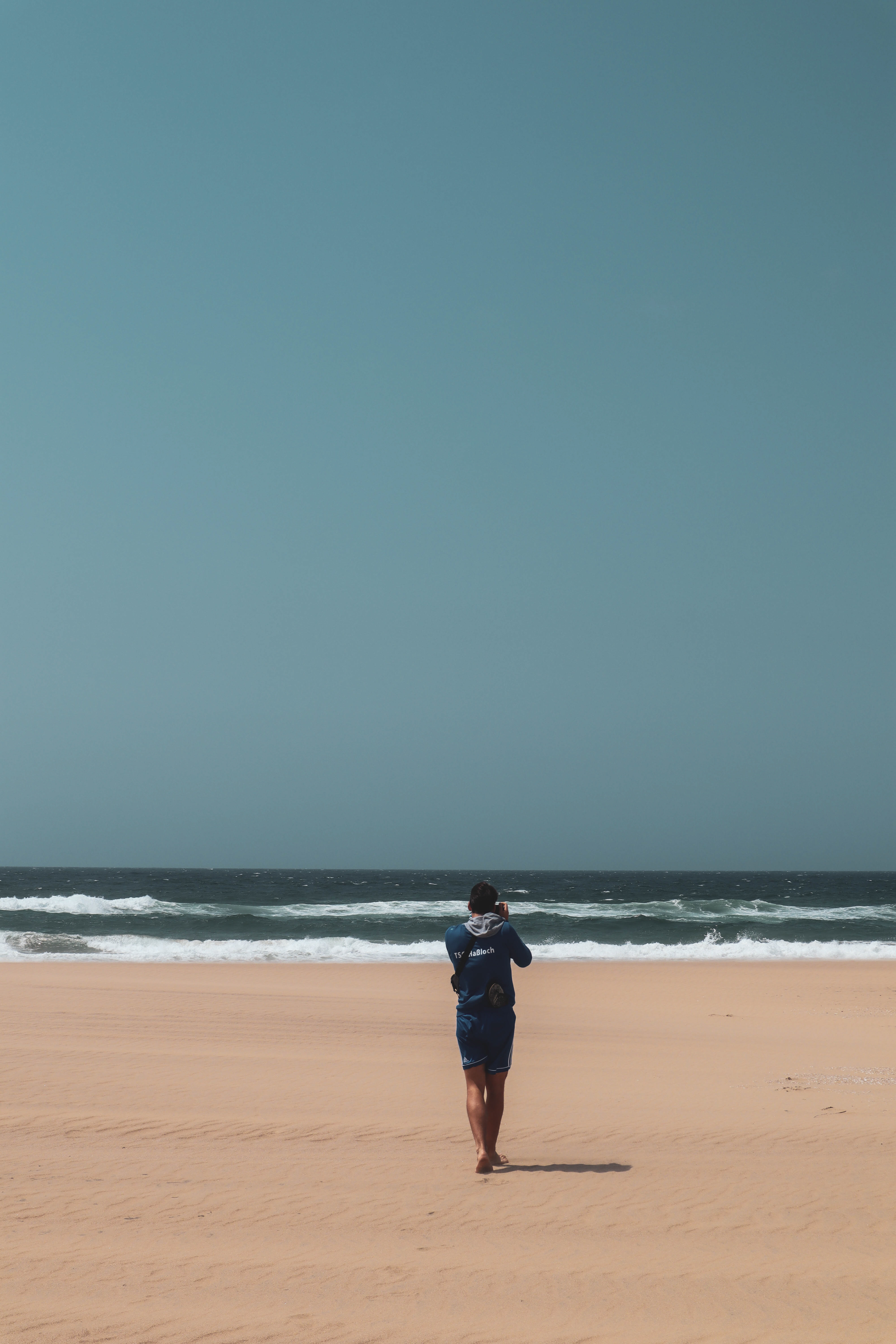 Myself walking on one of the beautiful but very windy beaches